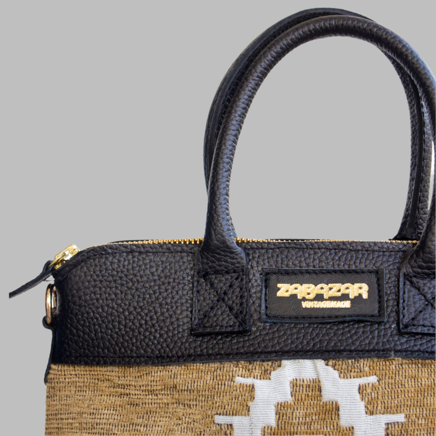 This Weekend Kilim Genuine Leather Bag is a gift to the world of Ancient craftsmanship meeting modern functionality. A statement of creativity, cultural awareness and limitless style. Handcrafted in Old Cairo, Egypt, this bag is a one of a kind masterpiece, made from vintage fabrics and genuine leather to embody the essence of sustainable luxury.