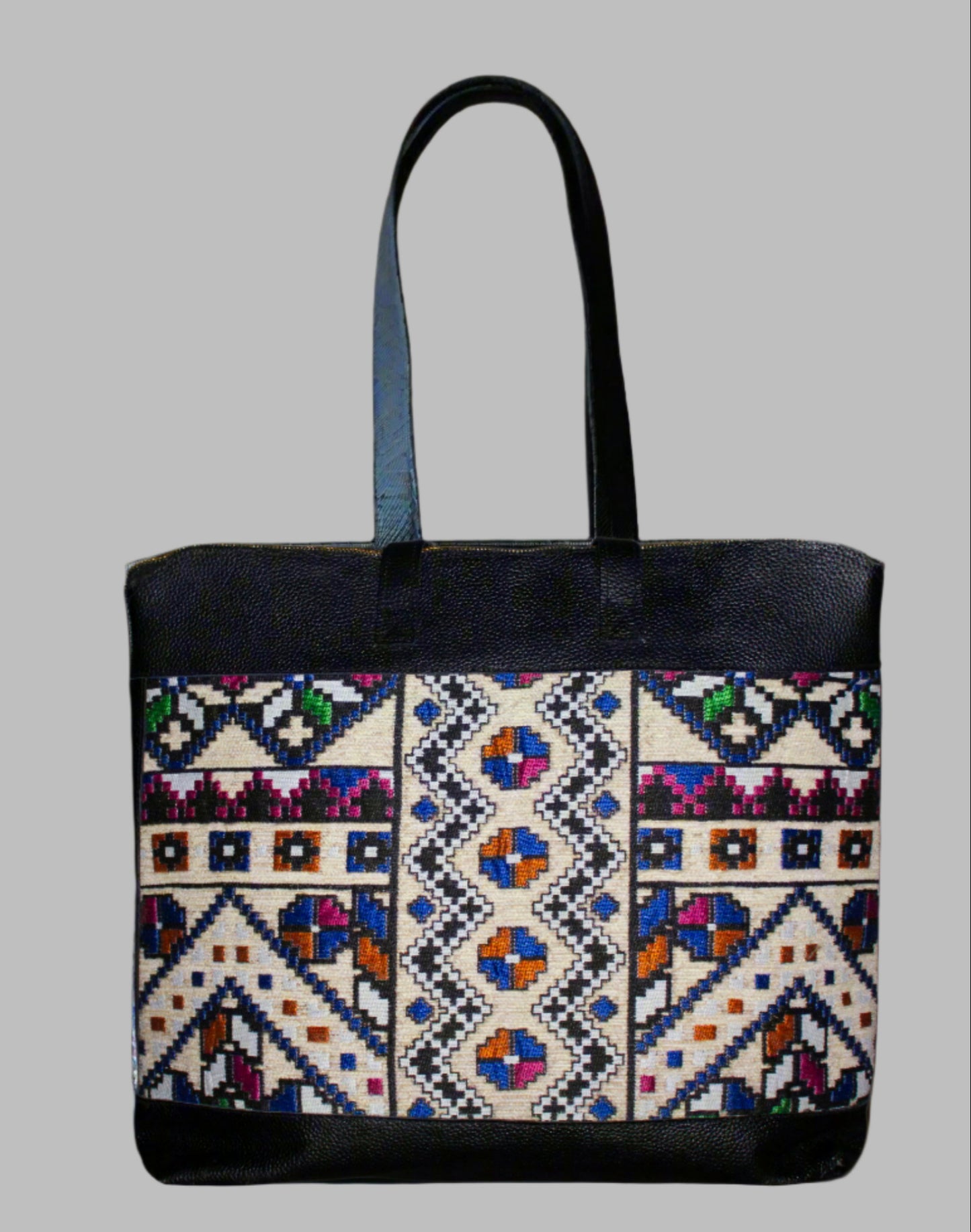 Weekend Kilim Genuine Leather Bag XL size is Handcrafted in Old Cairo, Egypt, This bag is one of a kind masterpiece, made from vintage fabrics and genuine leather to embody the essence of sustainable luxury.a gift to the world of Ancient craftsmanship meeting modern functionality. A statement of creativity, cultural awareness and limitless style.