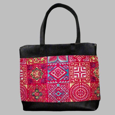 Weekend Kilim Genuine Leather Bag XL size is Handcrafted in Old Cairo, Egypt, This bag is one of a kind masterpiece, made from vintage fabrics and genuine leather to embody the essence of sustainable luxury.a gift to the world of Ancient craftsmanship meeting modern functionality. A statement of creativity, cultural awareness and limitless style.