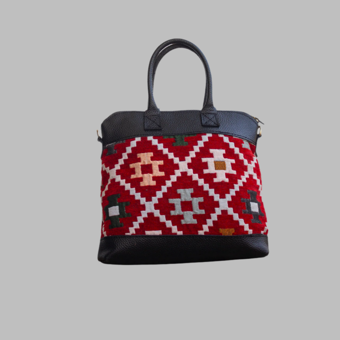 Weekend Kilim Genuine Leather Bag is Handcrafted in Old Cairo, Egypt, This bag is one of a kind masterpiece, made from vintage fabrics and genuine leather to embody the essence of sustainable luxury.a gift to the world of Ancient craftsmanship meeting modern functionality. A statement of creativity, cultural awareness and limitless style.