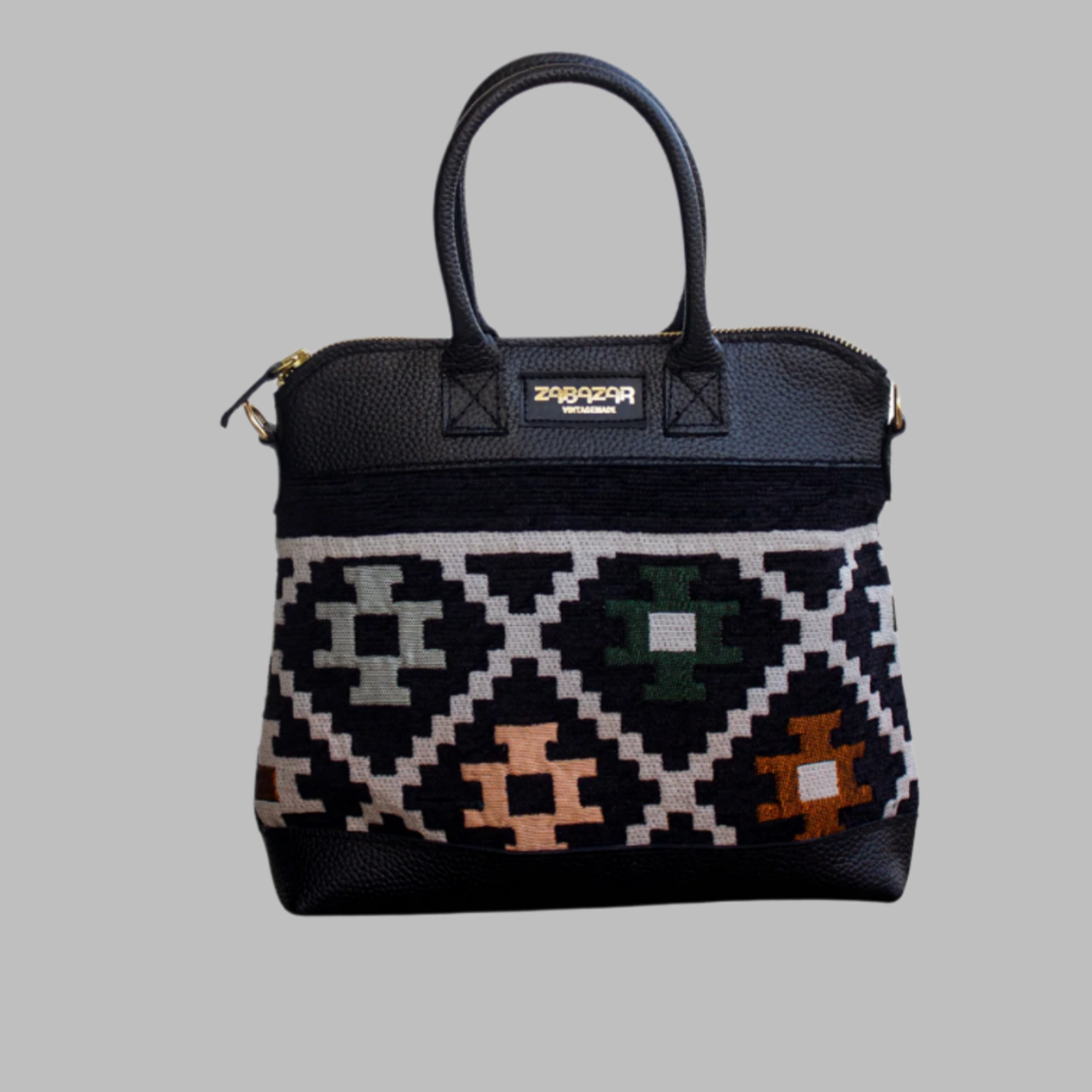 Weekend Kilim Genuine Leather Bag is Handcrafted in Old Cairo, Egypt, This bag is one of a kind masterpiece, made from vintage fabrics and genuine leather to embody the essence of sustainable luxury.a gift to the world of Ancient craftsmanship meeting modern functionality. A statement of creativity, cultural awareness and limitless style.