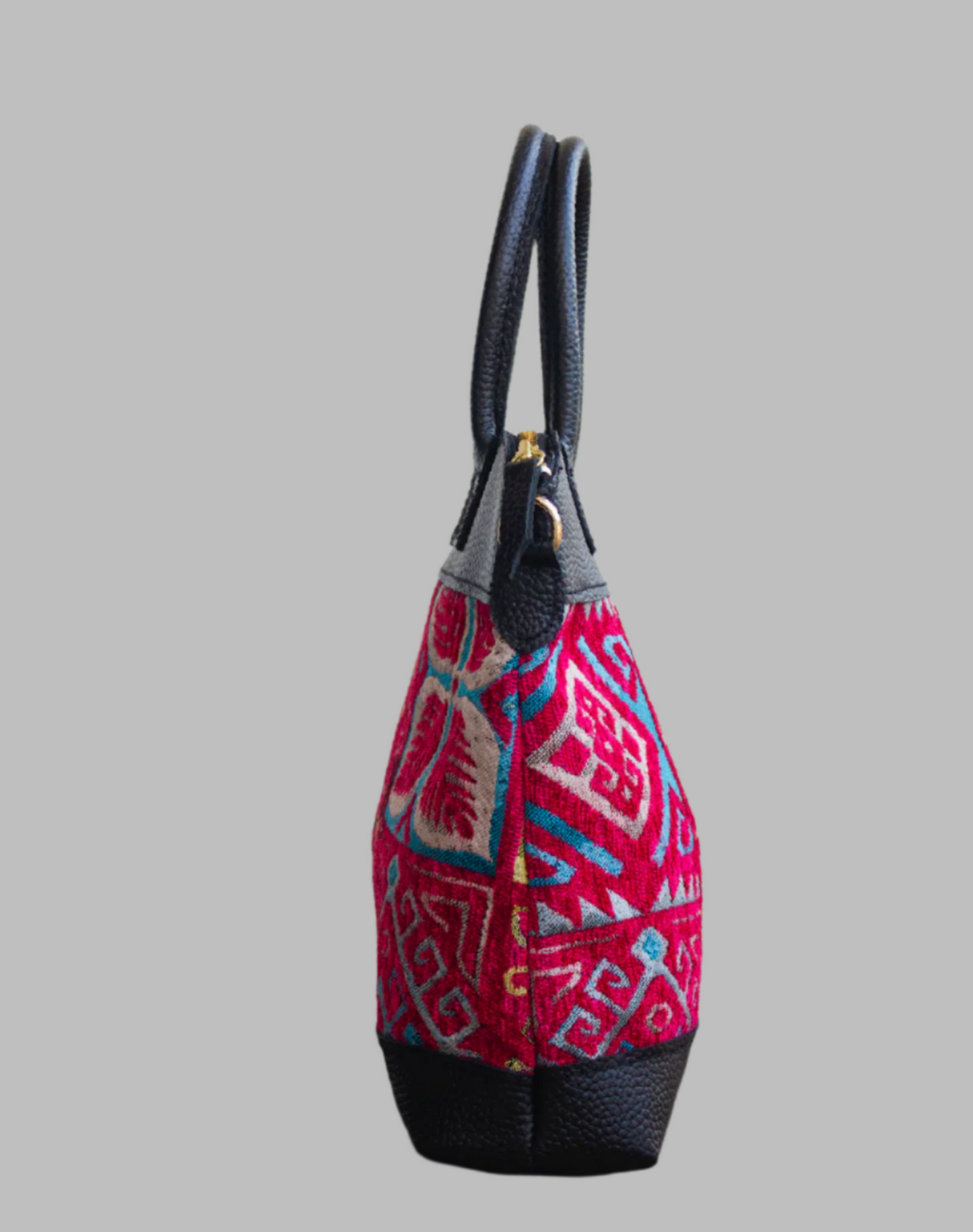 Weekend Kilim Genuine Leather Bag is Handcrafted in Old Cairo, Egypt, This bag is one of a kind masterpiece, made from vintage fabrics and genuine leather to embody the essence of sustainable luxury.a gift to the world of Ancient craftsmanship meeting modern functionality. A statement of creativity, cultural awareness and limitless style.