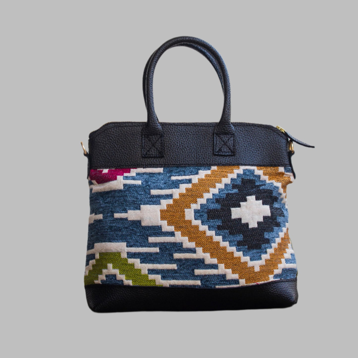 Weekend Kilim Genuine Leather Bag is Handcrafted in Old Cairo, Egypt, This bag is one of a kind masterpiece, made from vintage fabrics and genuine leather to embody the essence of sustainable luxury.a gift to the world of Ancient craftsmanship meeting modern functionality. A statement of creativity, cultural awareness and limitless style.
