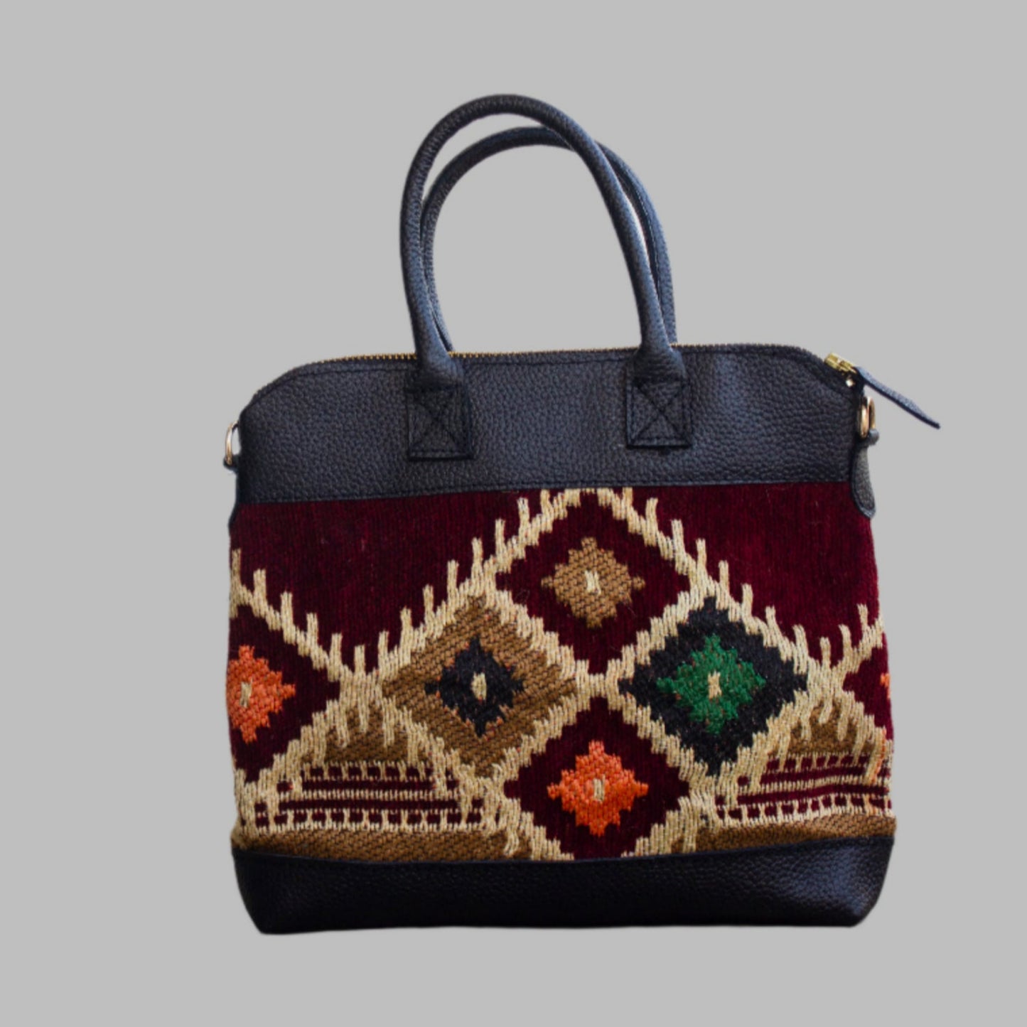 Weekend Kilim Genuine Leather Bag is Handcrafted in Old Cairo, Egypt, This bag is one of a kind masterpiece, made from vintage fabrics and genuine leather to embody the essence of sustainable luxury.a gift to the world of Ancient craftsmanship meeting modern functionality. A statement of creativity, cultural awareness and limitless style.