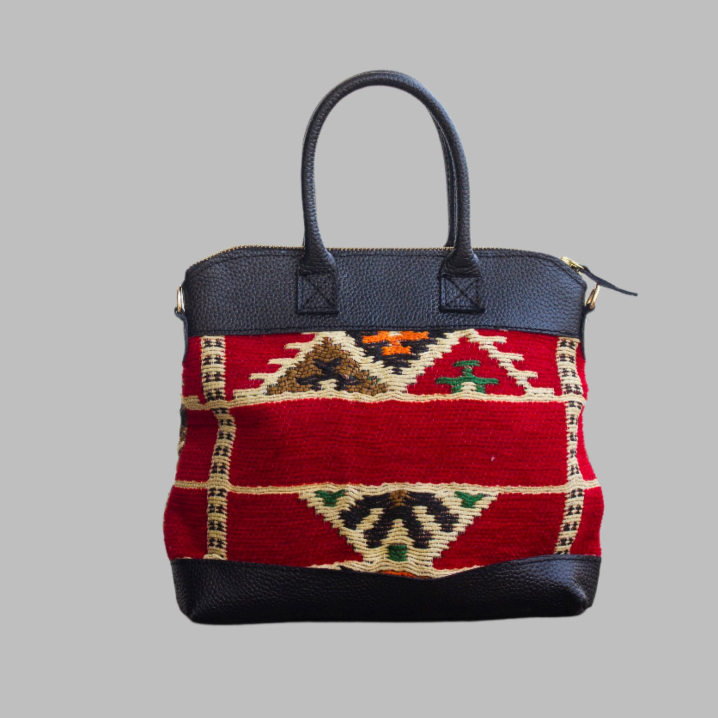 Weekend Kilim Genuine Leather Bag is Handcrafted in Old Cairo, Egypt, This bag is one of a kind masterpiece, made from vintage fabrics and genuine leather to embody the essence of sustainable luxury.a gift to the world of Ancient craftsmanship meeting modern functionality. A statement of creativity, cultural awareness and limitless style.