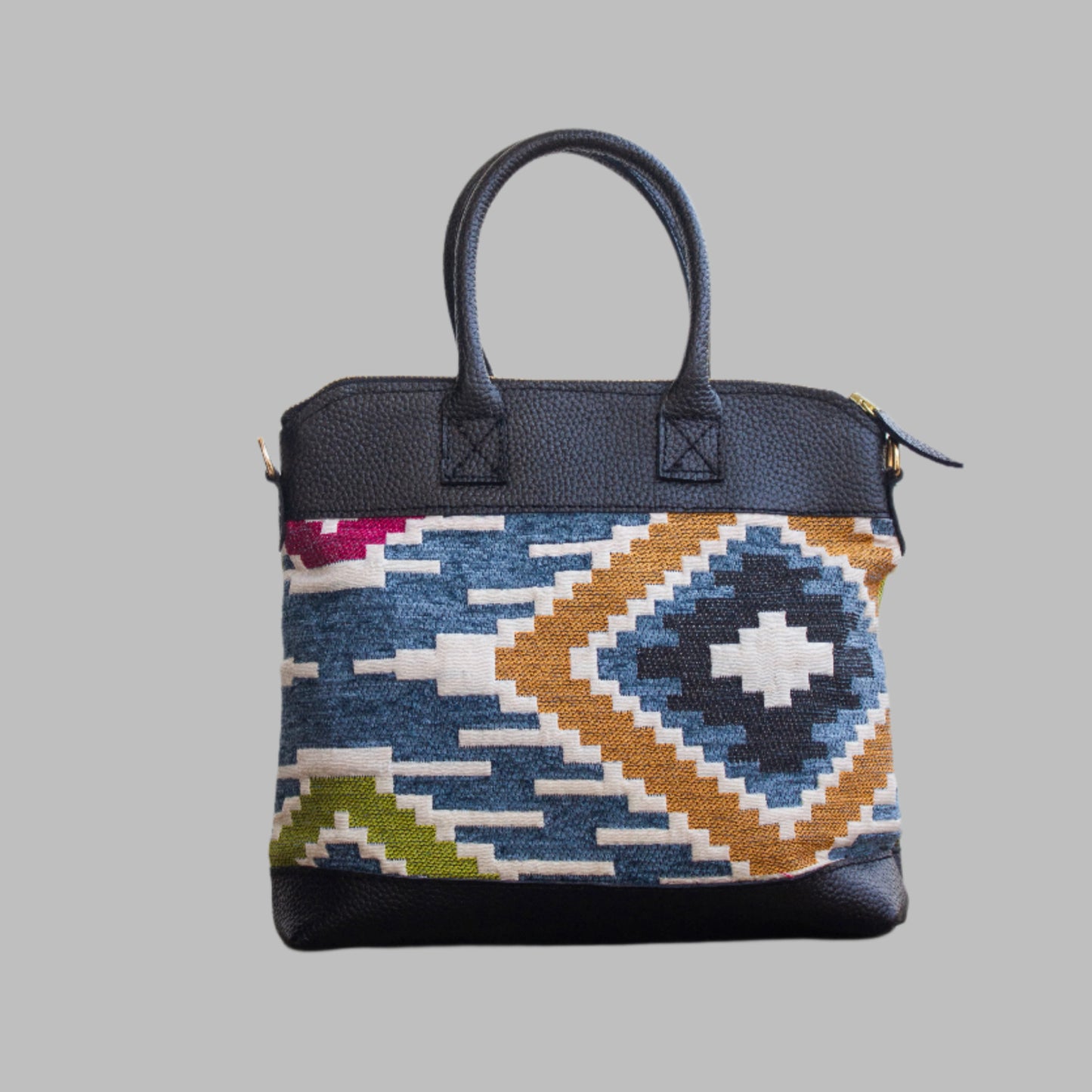 Weekend Kilim Genuine Leather Bag is Handcrafted in Old Cairo, Egypt, This bag is one of a kind masterpiece, made from vintage fabrics and genuine leather to embody the essence of sustainable luxury.a gift to the world of Ancient craftsmanship meeting modern functionality. A statement of creativity, cultural awareness and limitless style.