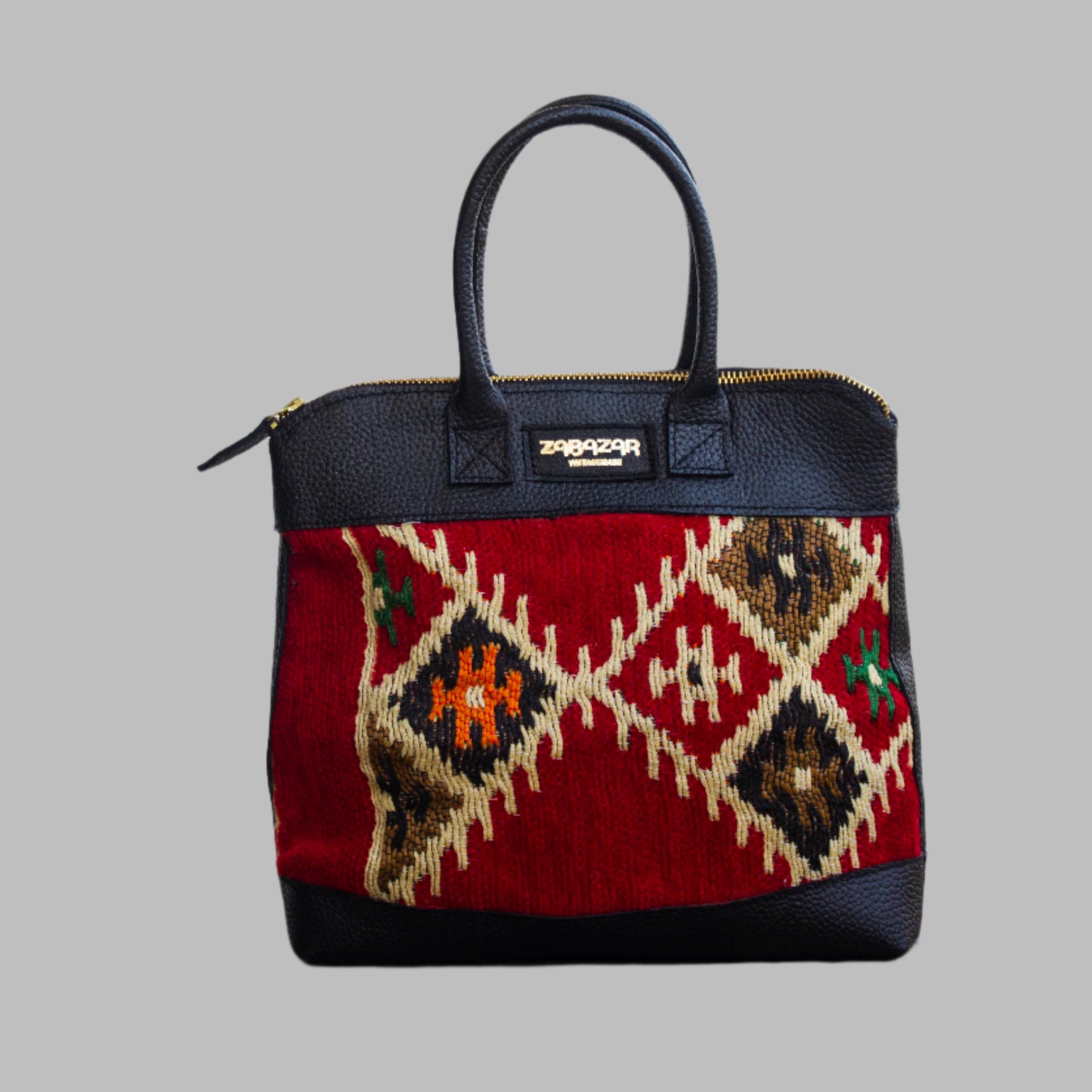 Weekend Kilim Genuine Leather Bag is Handcrafted in Old Cairo, Egypt, This bag is one of a kind  masterpiece, made from vintage fabrics and genuine leather to embody the essence of sustainable luxury.a gift to the world of Ancient craftsmanship meeting modern functionality. A statement of creativity, cultural awareness and limitless style.