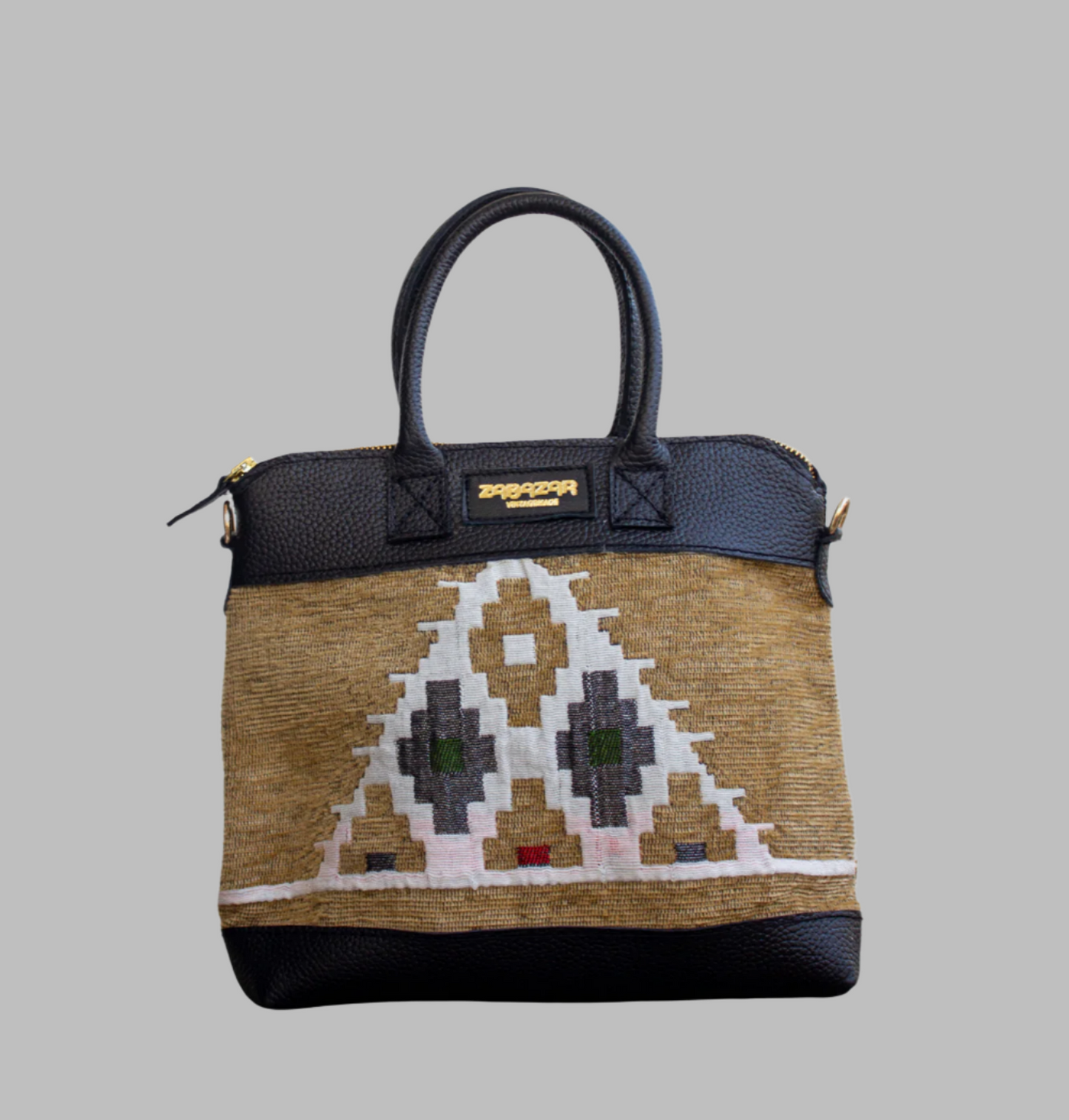 Weekend Kilim Genuine Leather Bag is Handcrafted in Old Cairo, Egypt, This bag is one of a kind  masterpiece, made from vintage fabrics and genuine leather to embody the essence of sustainable luxury.a gift to the world of Ancient craftsmanship meeting modern functionality. A statement of creativity, cultural awareness and limitless style.