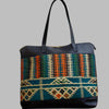 Weekend Kilim Genuine Leather Bag XL size is Handcrafted in Old Cairo, Egypt, This bag is one of a kind  masterpiece, made from vintage fabrics and genuine leather to embody the essence of sustainable luxury.a gift to the world of Ancient craftsmanship meeting modern functionality. A statement of creativity, cultural awareness and limitless style.