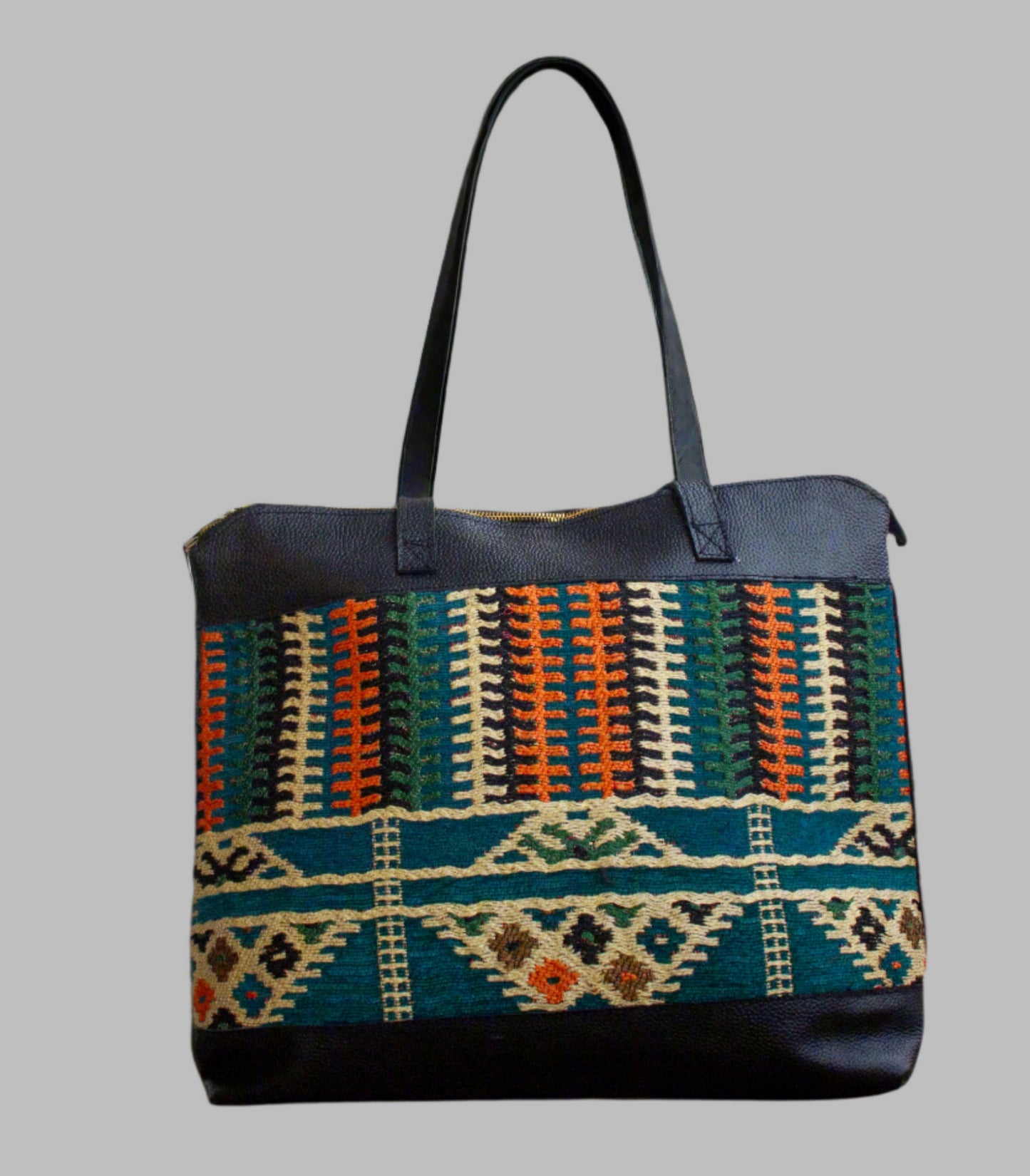 Weekend Kilim Genuine Leather Bag XL size is Handcrafted in Old Cairo, Egypt, This bag is one of a kind  masterpiece, made from vintage fabrics and genuine leather to embody the essence of sustainable luxury.a gift to the world of Ancient craftsmanship meeting modern functionality. A statement of creativity, cultural awareness and limitless style.
