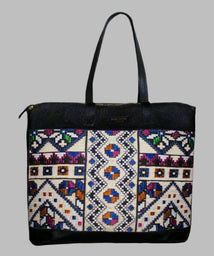 Weekend Kilim Genuine Leather Bag XL size is Handcrafted in Old Cairo, Egypt, This bag is one of a kind  masterpiece, made from vintage fabrics and genuine leather to embody the essence of sustainable luxury.a gift to the world of Ancient craftsmanship meeting modern functionality. A statement of creativity, cultural awareness and limitless style.