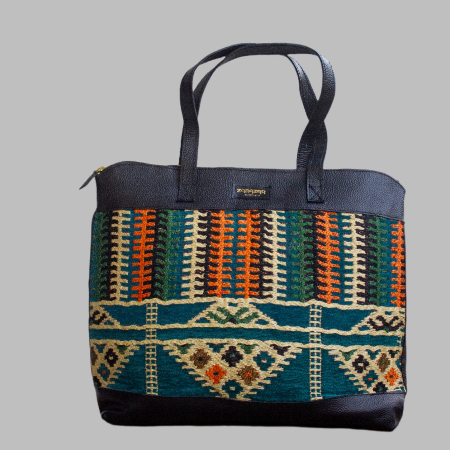 Weekend Kilim Genuine Leather Bag XL size is Handcrafted in Old Cairo, Egypt, This bag is one of a kind  masterpiece, made from vintage fabrics and genuine leather to embody the essence of sustainable luxury.a gift to the world of Ancient craftsmanship meeting modern functionality. A statement of creativity, cultural awareness and limitless style.