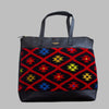 Weekend Kilim Genuine Leather Bag XL size is Handcrafted in Old Cairo, Egypt, This bag is one of a kind  masterpiece, made from vintage fabrics and genuine leather to embody the essence of sustainable luxury.a gift to the world of Ancient craftsmanship meeting modern functionality. A statement of creativity, cultural awareness and limitless style.