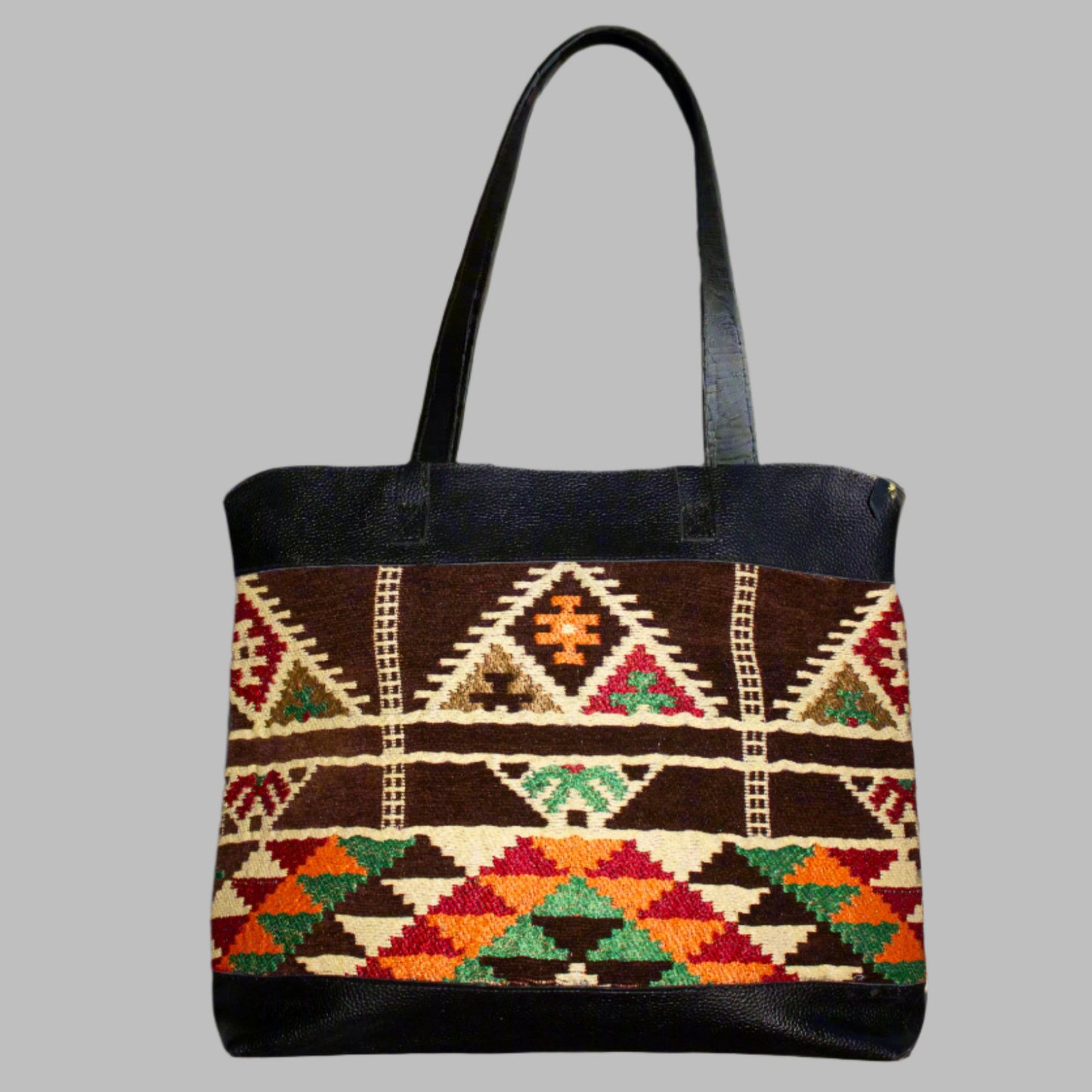 Weekend Kilim Genuine Leather Bag XL size is Handcrafted in Old Cairo, Egypt, This bag is one of a kind  masterpiece, made from vintage fabrics and genuine leather to embody the essence of sustainable luxury.a gift to the world of Ancient craftsmanship meeting modern functionality. A statement of creativity, cultural awareness and limitless style.
