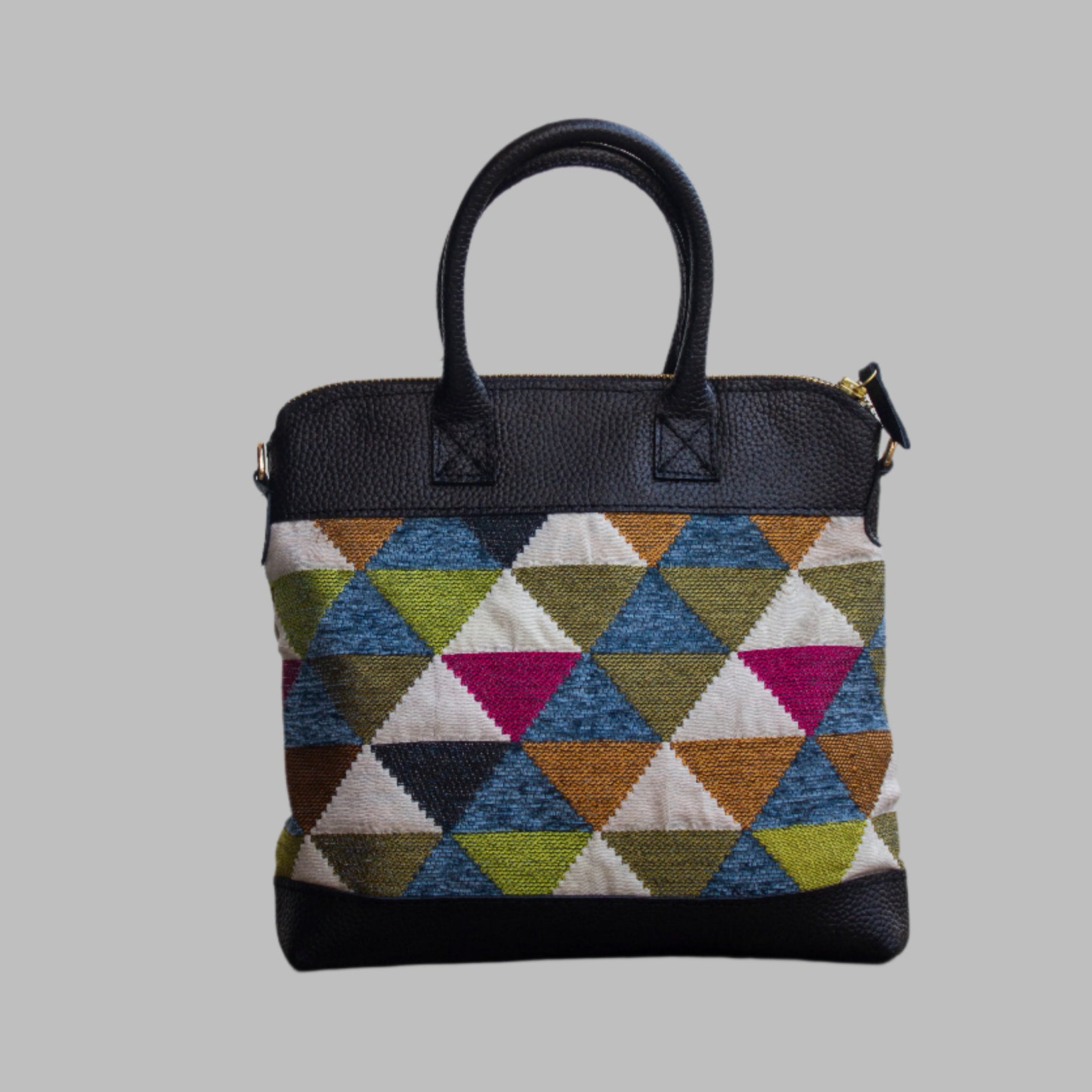 Weekend Kilim Genuine Leather Bag is Handcrafted in Old Cairo, Egypt, This bag is one of a kind  masterpiece, made from vintage fabrics and genuine leather to embody the essence of sustainable luxury.a gift to the world of Ancient craftsmanship meeting modern functionality. A statement of creativity, cultural awareness and limitless style.