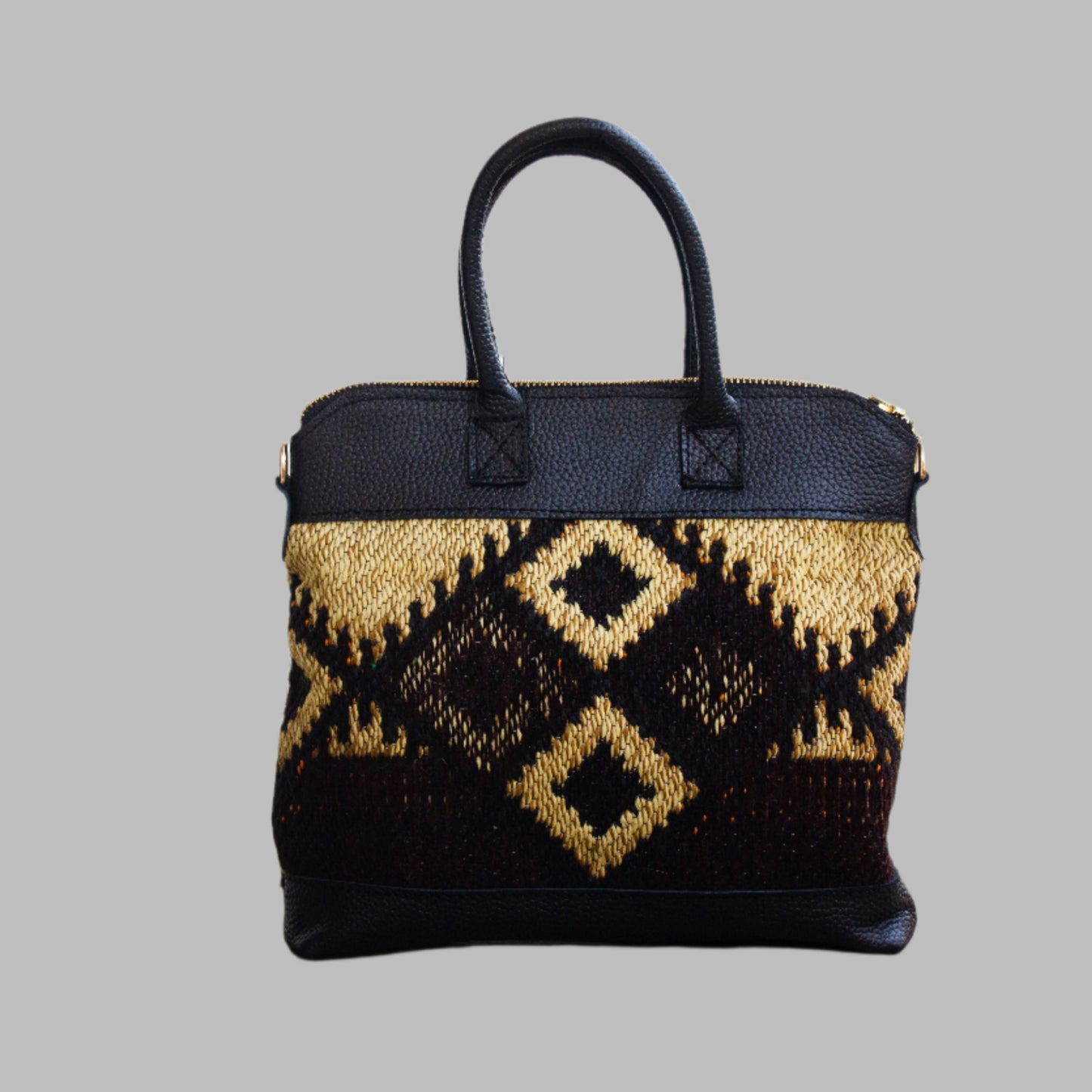 Weekend Kilim Genuine Leather Bag is Handcrafted in Old Cairo, Egypt, This bag is one of a kind  masterpiece, made from vintage fabrics and genuine leather to embody the essence of sustainable luxury.a gift to the world of Ancient craftsmanship meeting modern functionality. A statement of creativity, cultural awareness and limitless style.