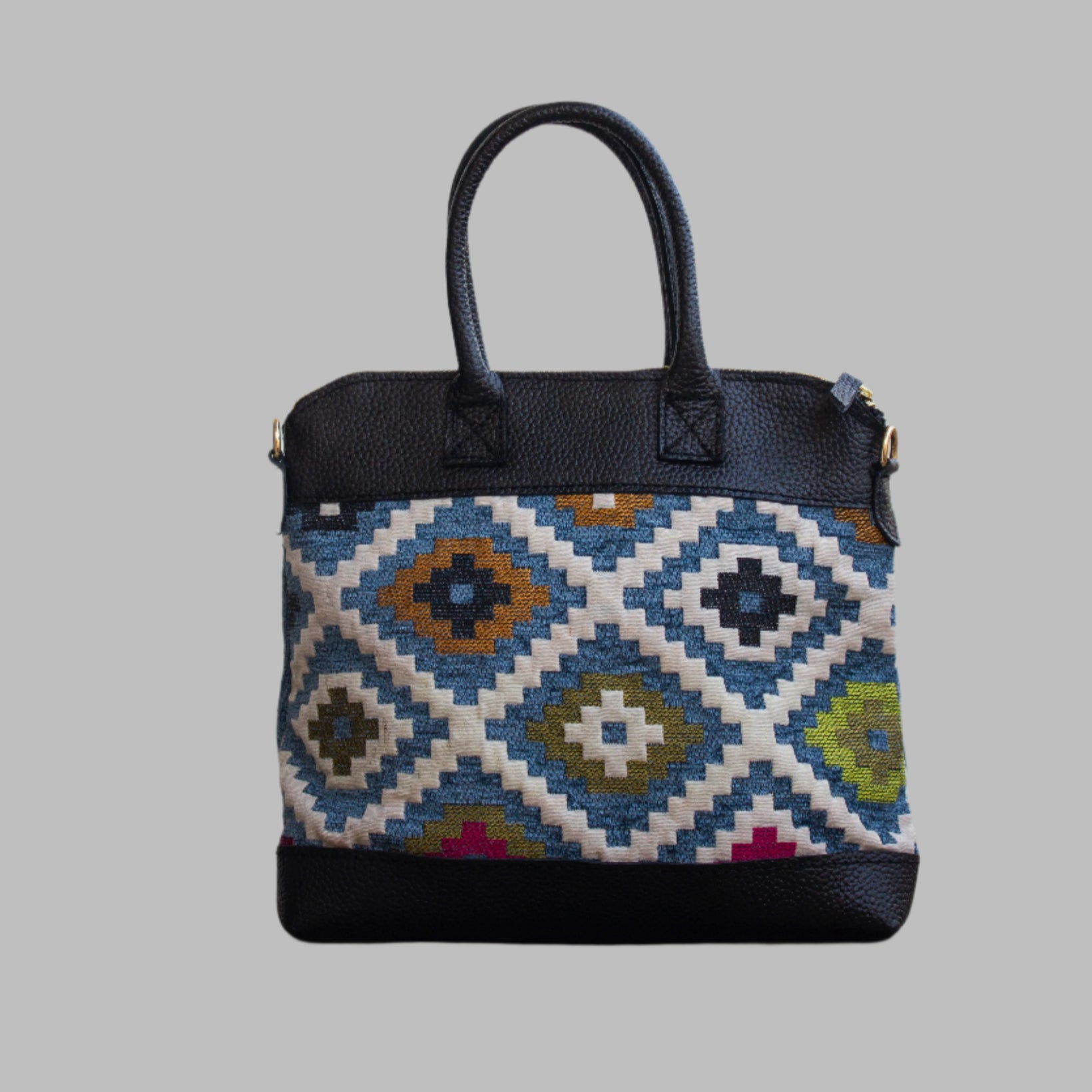 Weekend Kilim Genuine Leather Bag is Handcrafted in Old Cairo, Egypt, This bag is one of a kind  masterpiece, made from vintage fabrics and genuine leather to embody the essence of sustainable luxury.a gift to the world of Ancient craftsmanship meeting modern functionality. A statement of creativity, cultural awareness and limitless style.