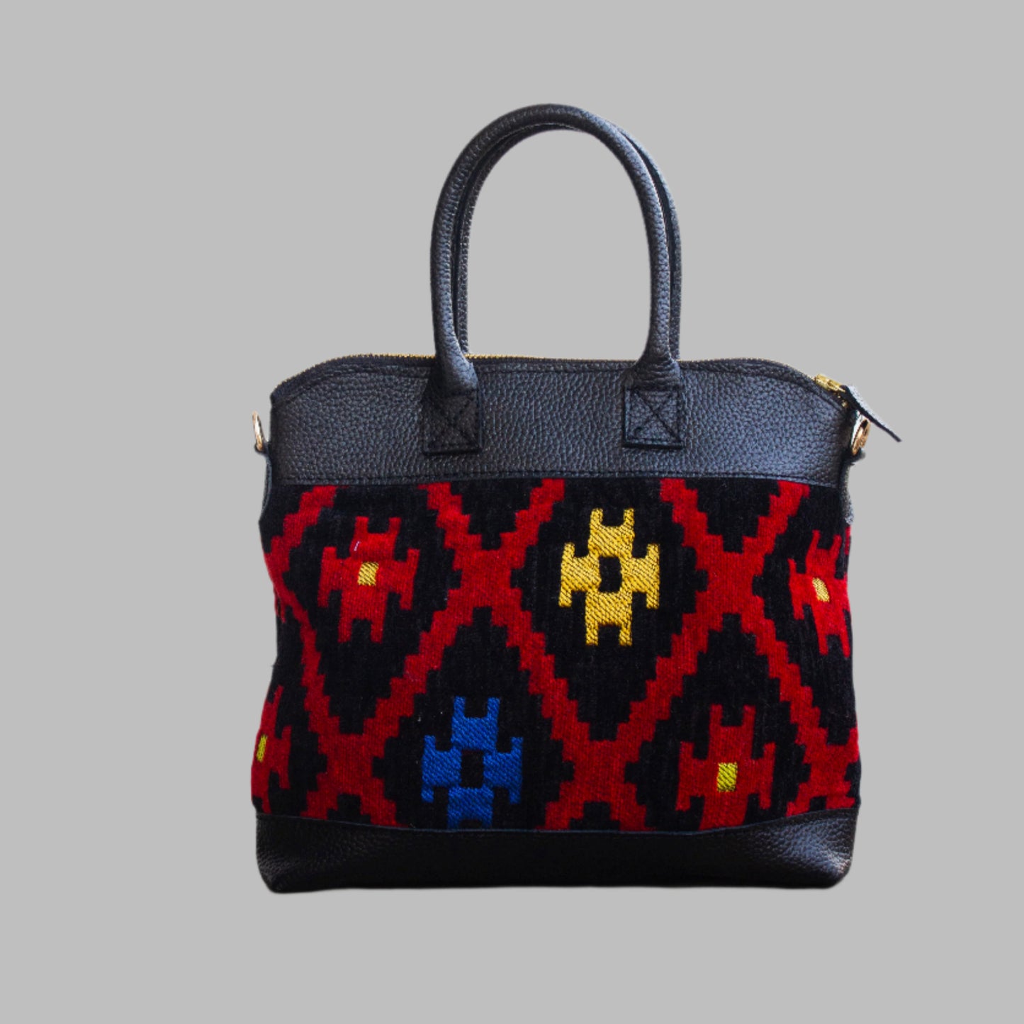Weekend Kilim Genuine Leather Bag is Handcrafted in Old Cairo, Egypt, This bag is one of a kind  masterpiece, made from vintage fabrics and genuine leather to embody the essence of sustainable luxury.a gift to the world of Ancient craftsmanship meeting modern functionality. A statement of creativity, cultural awareness and limitless style.