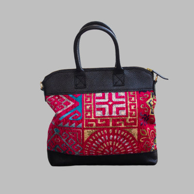 Weekend Kilim Genuine Leather Bag is Handcrafted in Old Cairo, Egypt, This bag is one of a kind  masterpiece, made from vintage fabrics and genuine leather to embody the essence of sustainable luxury.a gift to the world of Ancient craftsmanship meeting modern functionality. A statement of creativity, cultural awareness and limitless style.