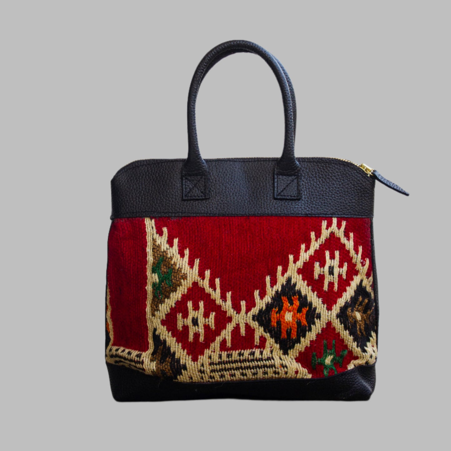 Weekend Kilim Genuine Leather Bag is Handcrafted in Old Cairo, Egypt, This bag is one of a kind  masterpiece, made from vintage fabrics and genuine leather to embody the essence of sustainable luxury.a gift to the world of Ancient craftsmanship meeting modern functionality. A statement of creativity, cultural awareness and limitless style.