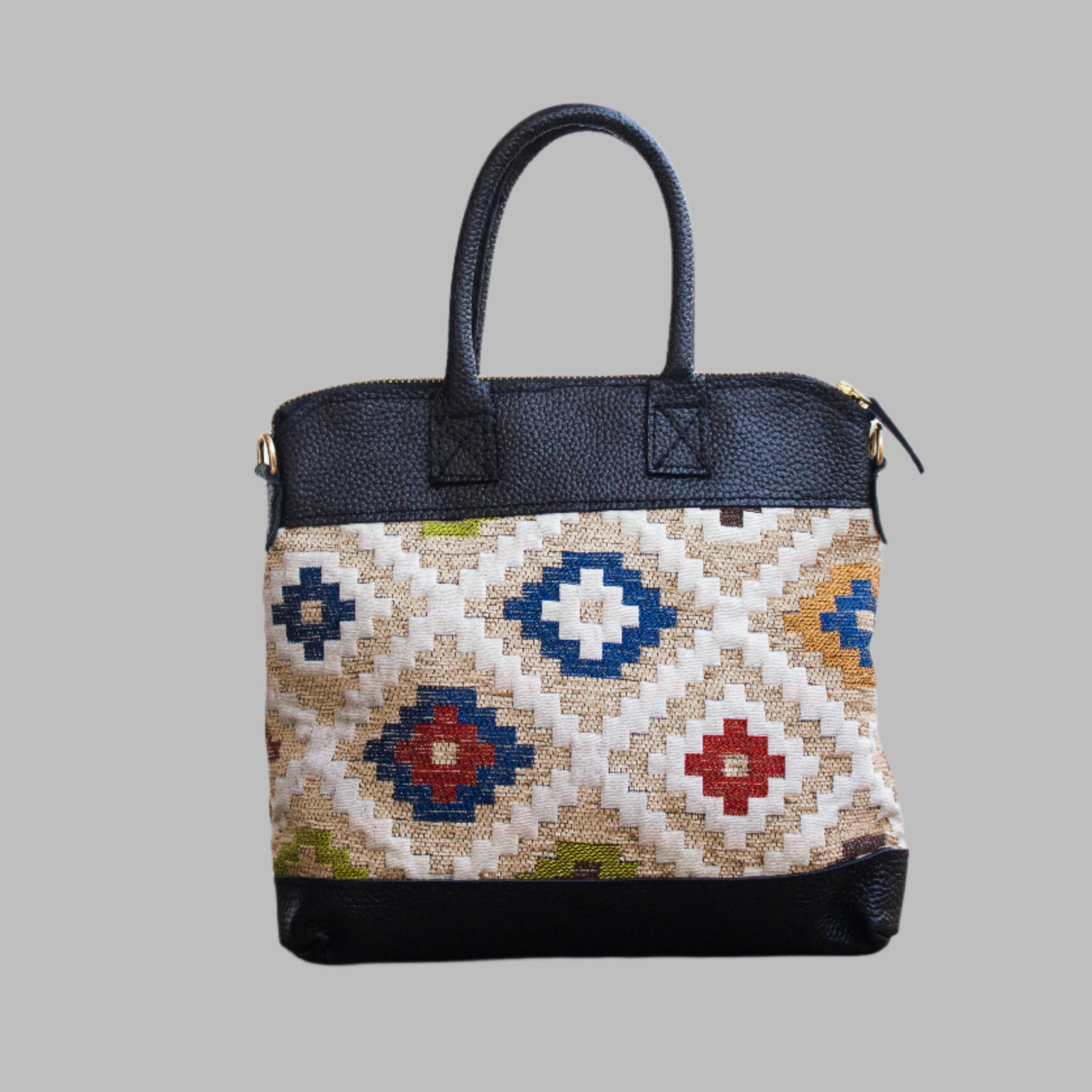 Weekend Kilim Genuine Leather Bag is Handcrafted in Old Cairo, Egypt, This bag is one of a kind  masterpiece, made from vintage fabrics and genuine leather to embody the essence of sustainable luxury.a gift to the world of Ancient craftsmanship meeting modern functionality. A statement of creativity, cultural awareness and limitless style.
