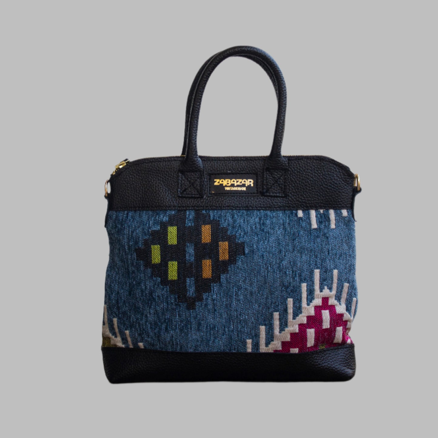 Weekend Kilim Genuine Leather Bag is Handcrafted in Old Cairo, Egypt, This bag is one of a kind  masterpiece, made from vintage fabrics and genuine leather to embody the essence of sustainable luxury.a gift to the world of Ancient craftsmanship meeting modern functionality. A statement of creativity, cultural awareness and limitless style.