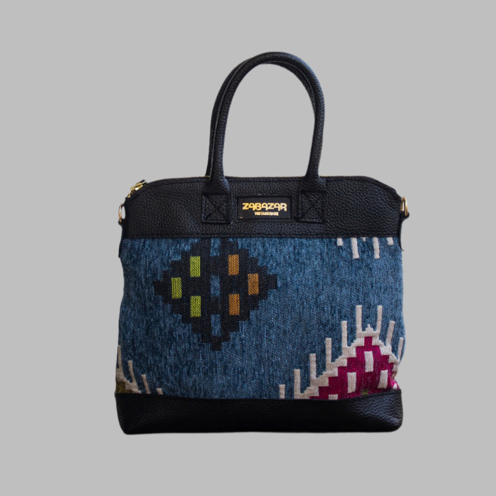 Weekend Kilim Genuine Leather Bag is Handcrafted in Old Cairo, Egypt, This bag is one of a kind  masterpiece, made from vintage fabrics and genuine leather to embody the essence of sustainable luxury.a gift to the world of Ancient craftsmanship meeting modern functionality. A statement of creativity, cultural awareness and limitless style.