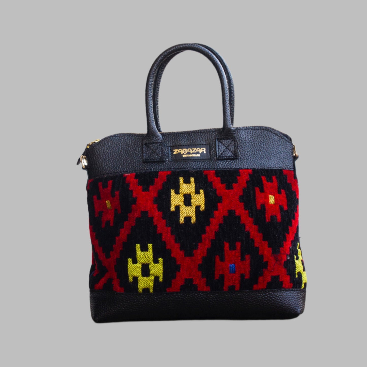 Weekend Kilim Genuine Leather Bag is Handcrafted in Old Cairo, Egypt, This bag is one of a kind  masterpiece, made from vintage fabrics and genuine leather to embody the essence of sustainable luxury.a gift to the world of Ancient craftsmanship meeting modern functionality. A statement of creativity, cultural awareness and limitless style.