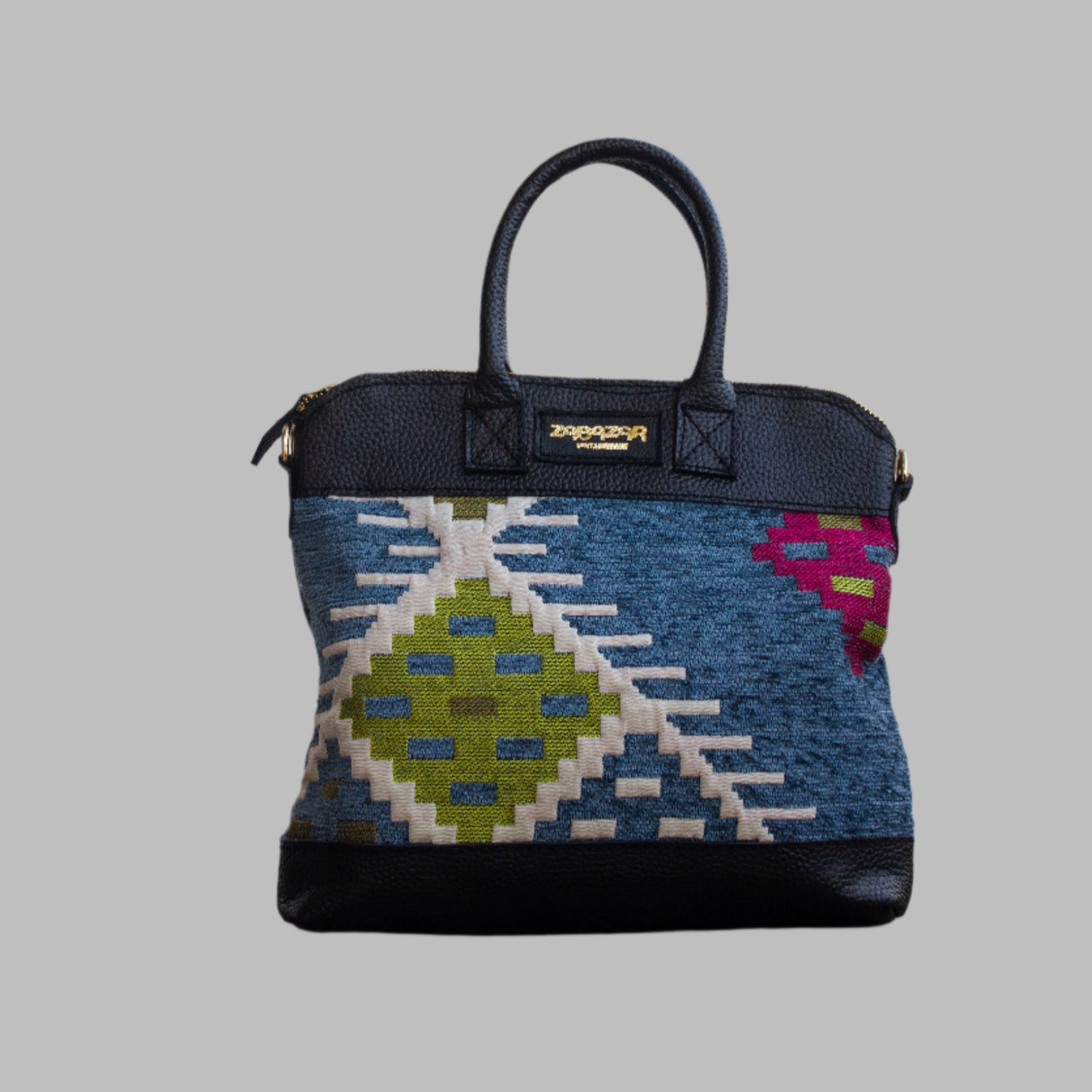 Weekend Kilim Genuine Leather Bag is Handcrafted in Old Cairo, Egypt, This bag is one of a kind  masterpiece, made from vintage fabrics and genuine leather to embody the essence of sustainable luxury.a gift to the world of Ancient craftsmanship meeting modern functionality. A statement of creativity, cultural awareness and limitless style.