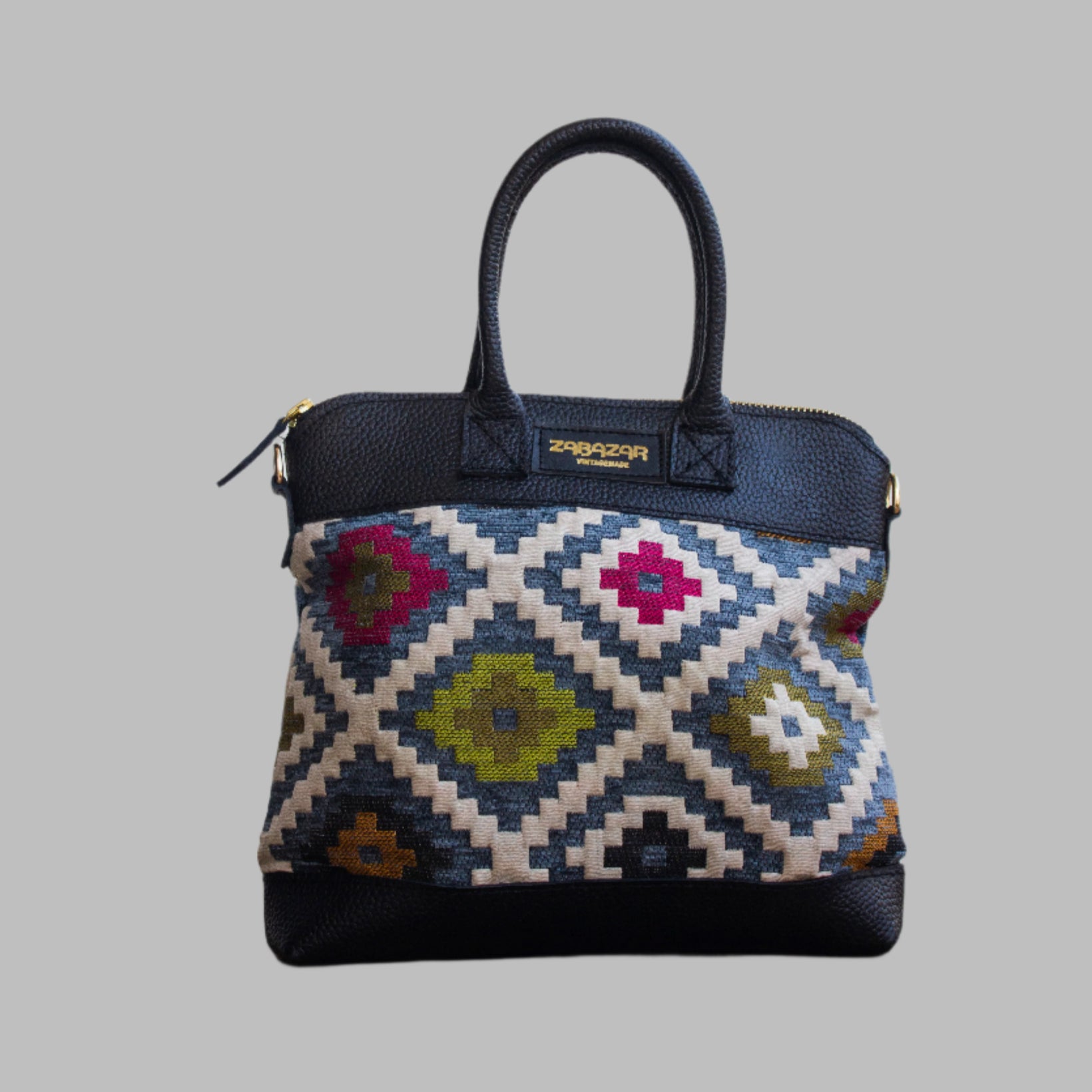 Weekend Kilim Genuine Leather Bag is Handcrafted in Old Cairo, Egypt, This bag is one of a kind  masterpiece, made from vintage fabrics and genuine leather to embody the essence of sustainable luxury.a gift to the world of Ancient craftsmanship meeting modern functionality. A statement of creativity, cultural awareness and limitless style.