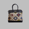 Weekend Kilim Genuine Leather Bag is Handcrafted in Old Cairo, Egypt, This bag is one of a kind  masterpiece, made from vintage fabrics and genuine leather to embody the essence of sustainable luxury.a gift to the world of Ancient craftsmanship meeting modern functionality. A statement of creativity, cultural awareness and limitless style.