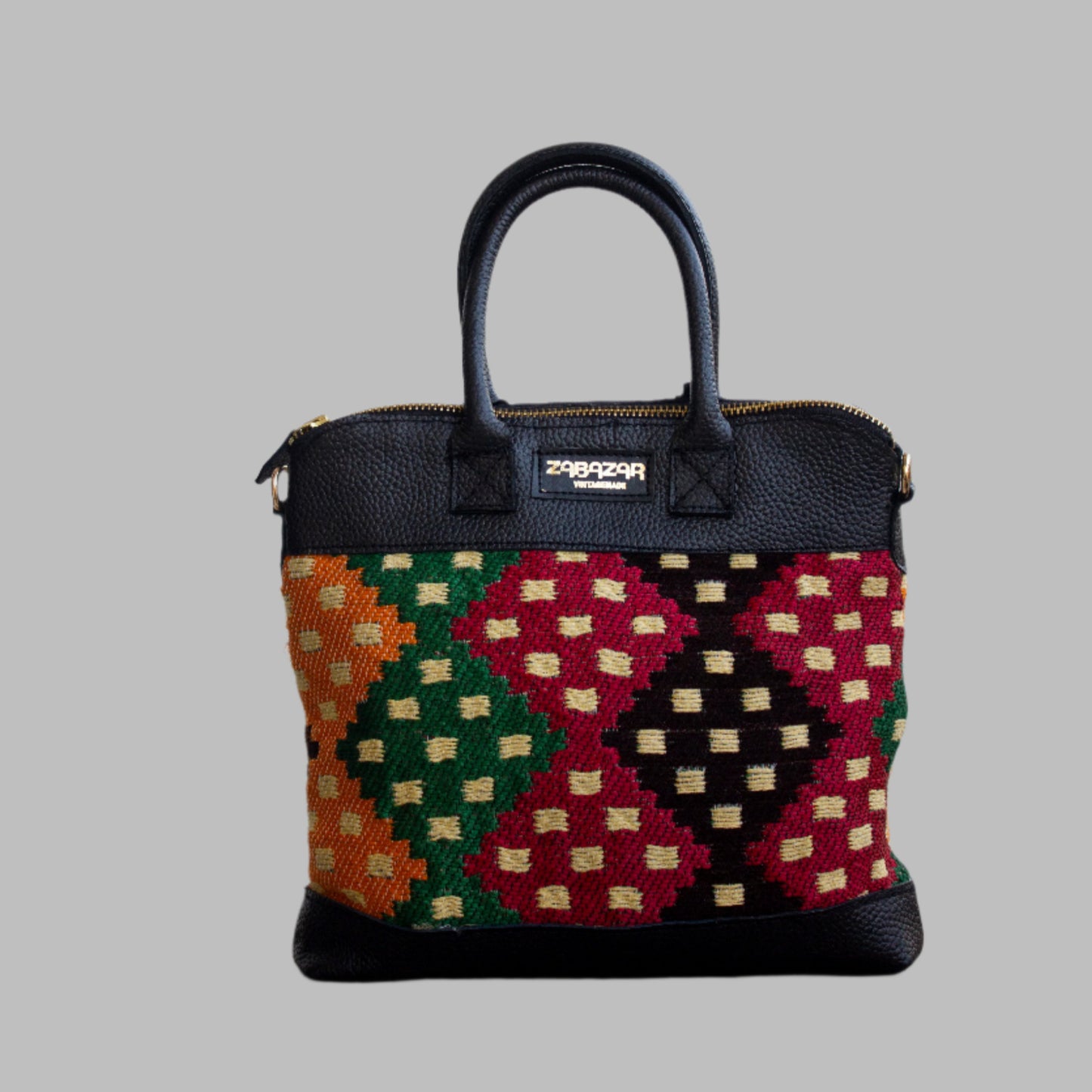 Weekend Kilim Genuine Leather Bag is Handcrafted in Old Cairo, Egypt, This bag is one of a kind  masterpiece, made from vintage fabrics and genuine leather to embody the essence of sustainable luxury.a gift to the world of Ancient craftsmanship meeting modern functionality. A statement of creativity, cultural awareness and limitless style.