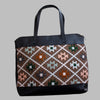 Weekend Kilim Genuine Leather Bag XL size is Handcrafted in Old Cairo, Egypt, This bag is one of a kind  masterpiece, made from vintage fabrics and genuine leather to embody the essence of sustainable luxury.a gift to the world of Ancient craftsmanship meeting modern functionality. A statement of creativity, cultural awareness and limitless style.
