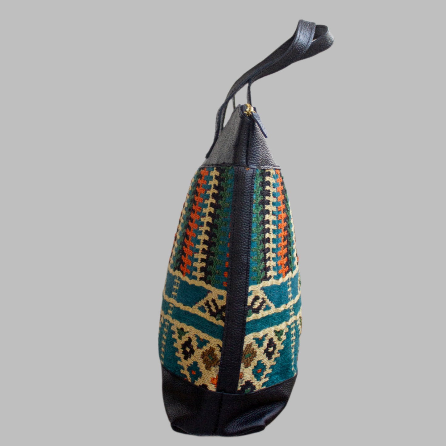 Weekend Kilim Genuine Leather Bag XL size is Handcrafted in Old Cairo, Egypt, This bag is one of a kind  masterpiece, made from vintage fabrics and genuine leather to embody the essence of sustainable luxury.a gift to the world of Ancient craftsmanship meeting modern functionality. A statement of creativity, cultural awareness and limitless style.