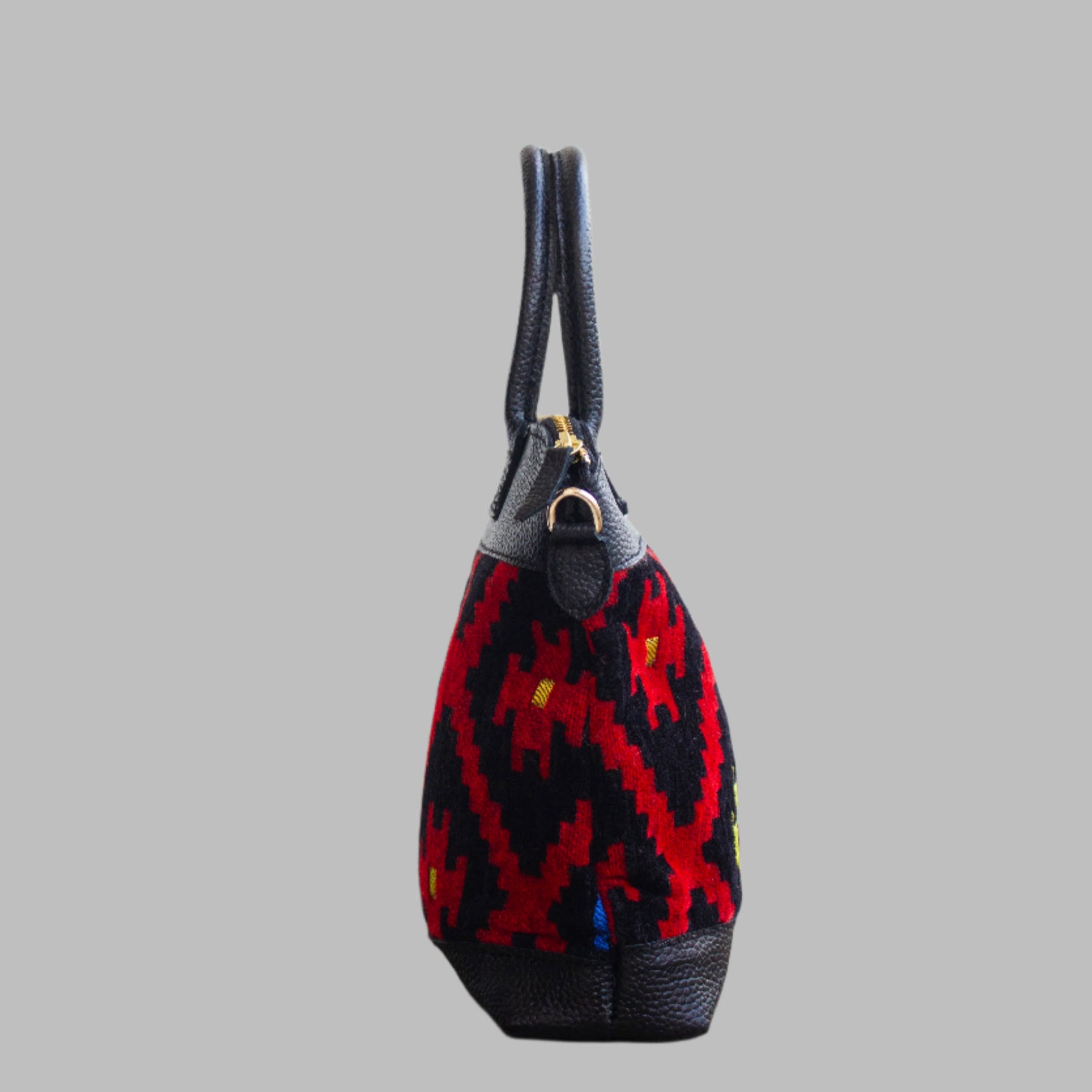 Weekend Kilim Genuine Leather Bag is Handcrafted in Old Cairo, Egypt, This bag is one of a kind  masterpiece, made from vintage fabrics and genuine leather to embody the essence of sustainable luxury.a gift to the world of Ancient craftsmanship meeting modern functionality. A statement of creativity, cultural awareness and limitless style.