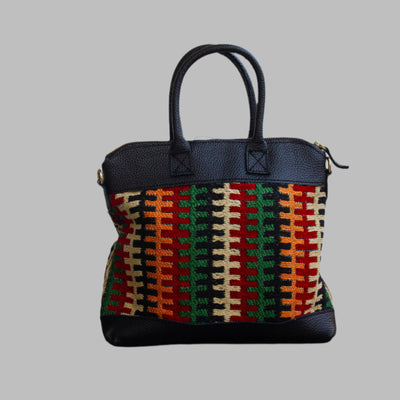 Weekend Kilim Genuine Leather Bag is Handcrafted in Old Cairo, Egypt, This bag is one of a kind  masterpiece, made from vintage fabrics and genuine leather to embody the essence of sustainable luxury.a gift to the world of Ancient craftsmanship meeting modern functionality. A statement of creativity, cultural awareness and limitless style.