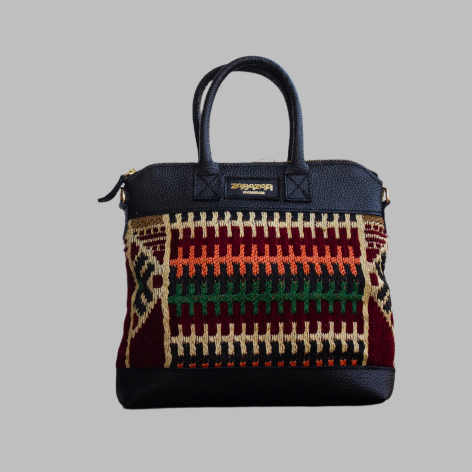 Weekend Kilim Genuine Leather Bag is Handcrafted in Old Cairo, Egypt, This bag is one of a kind  masterpiece, made from vintage fabrics and genuine leather to embody the essence of sustainable luxury.a gift to the world of Ancient craftsmanship meeting modern functionality. A statement of creativity, cultural awareness and limitless style.