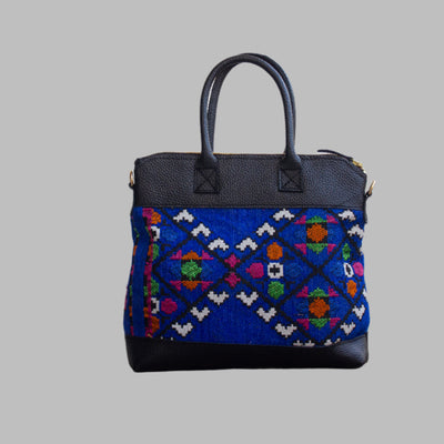 Weekend Kilim Genuine Leather Bag is Handcrafted in Old Cairo, Egypt, This bag is one of a kind  masterpiece, made from vintage fabrics and genuine leather to embody the essence of sustainable luxury.a gift to the world of Ancient craftsmanship meeting modern functionality. A statement of creativity, cultural awareness and limitless style.