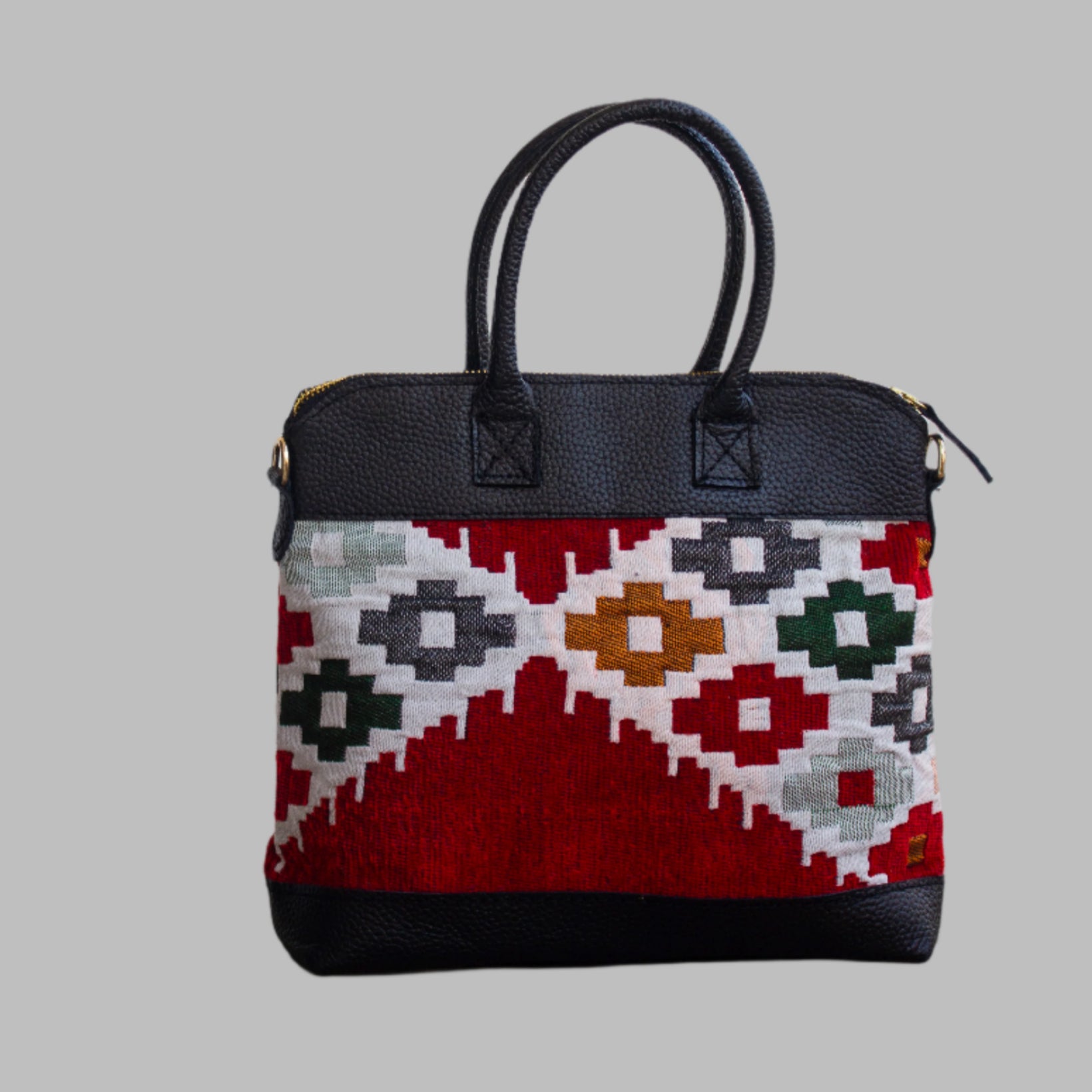 Weekend Kilim Genuine Leather Bag is Handcrafted in Old Cairo, Egypt, This bag is one of a kind  masterpiece, made from vintage fabrics and genuine leather to embody the essence of sustainable luxury.a gift to the world of Ancient craftsmanship meeting modern functionality. A statement of creativity, cultural awareness and limitless style.