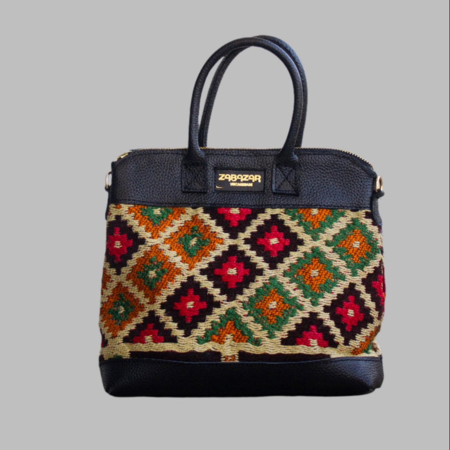 Weekend Kilim Genuine Leather Bag is Handcrafted in Old Cairo, Egypt, This bag is one of a kind  masterpiece, made from vintage fabrics and genuine leather to embody the essence of sustainable luxury.a gift to the world of Ancient craftsmanship meeting modern functionality. A statement of creativity, cultural awareness and limitless style.