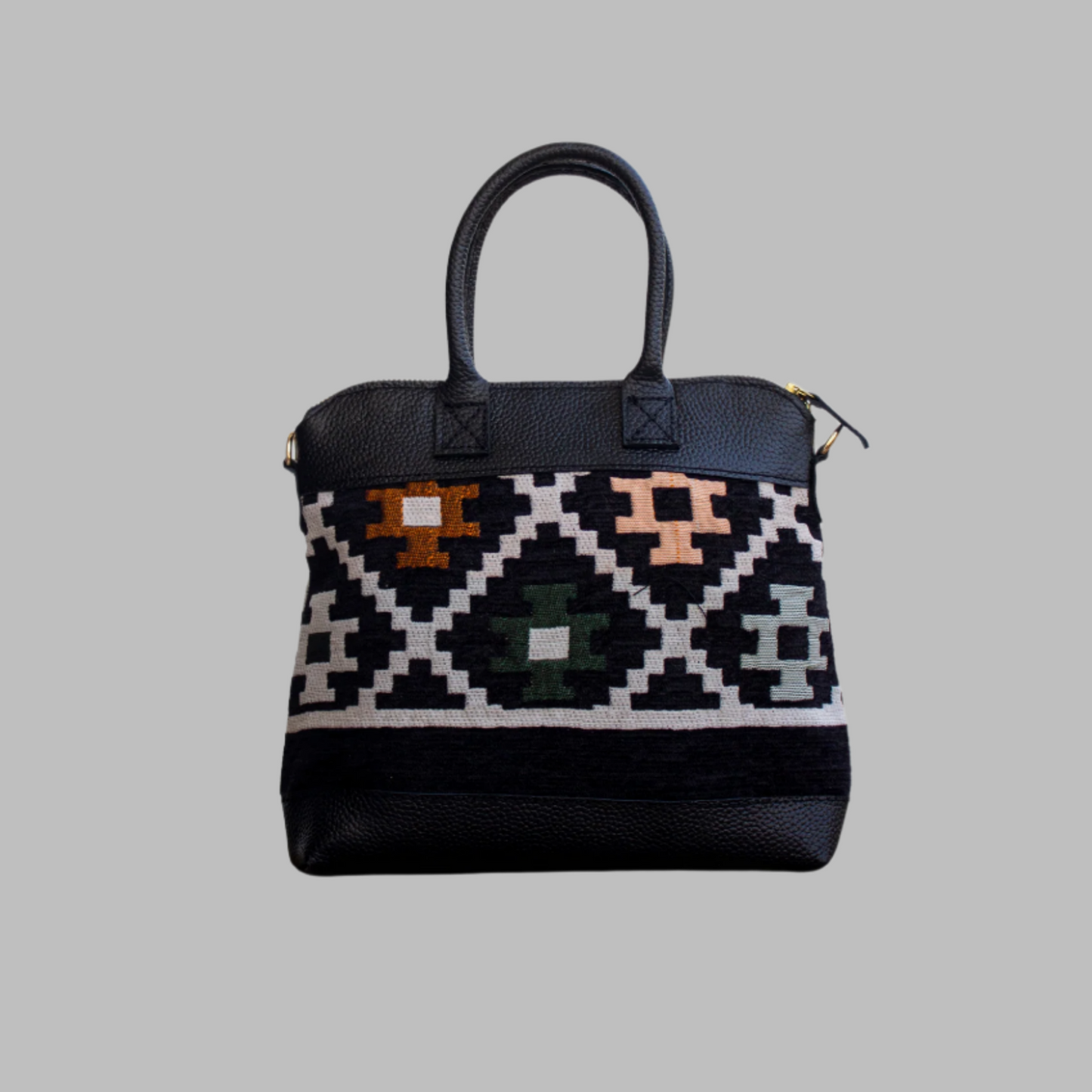 Weekend Kilim Genuine Leather Bag is Handcrafted in Old Cairo, Egypt, This bag is one of a kind  masterpiece, made from vintage fabrics and genuine leather to embody the essence of sustainable luxury.a gift to the world of Ancient craftsmanship meeting modern functionality. A statement of creativity, cultural awareness and limitless style.