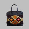 Weekend Kilim Genuine Leather Bag is Handcrafted in Old Cairo, Egypt, This bag is one of a kind  masterpiece, made from vintage fabrics and genuine leather to embody the essence of sustainable luxury.a gift to the world of Ancient craftsmanship meeting modern functionality. A statement of creativity, cultural awareness and limitless style.