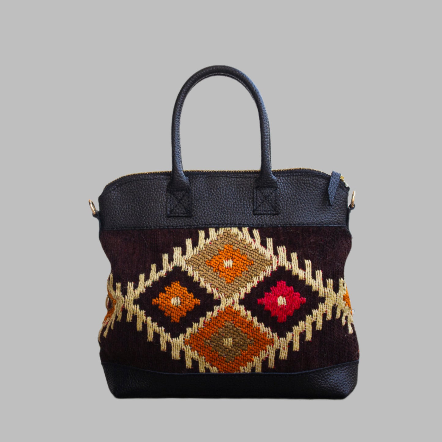 Weekend Kilim Genuine Leather Bag is Handcrafted in Old Cairo, Egypt, This bag is one of a kind  masterpiece, made from vintage fabrics and genuine leather to embody the essence of sustainable luxury.a gift to the world of Ancient craftsmanship meeting modern functionality. A statement of creativity, cultural awareness and limitless style.