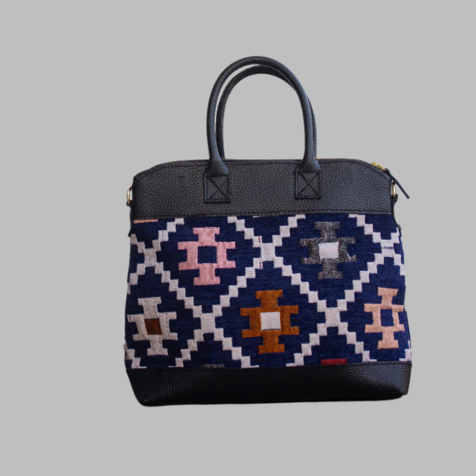 is one of a kind  masterpiece, made from vintage fabrics and genuine leather to embody the essence of sustainable luxury.a gift to the world of Ancient craftsmanship meeting modern functionality. A statement of creativity, cultural awareness and limitless style.