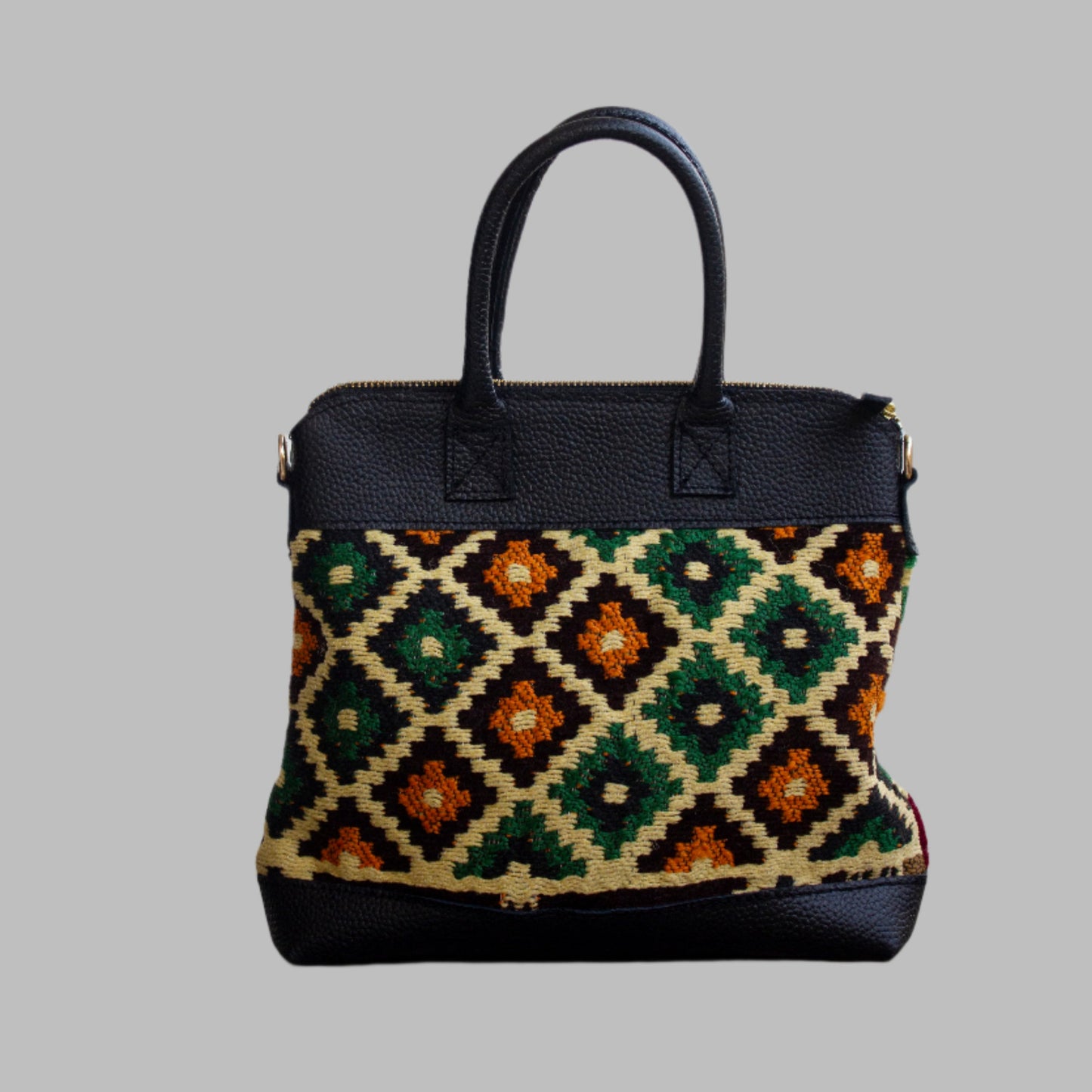 Weekend Kilim Genuine Leather Bag is Handcrafted in Old Cairo, Egypt, This bag is one of a kind  masterpiece, made from vintage fabrics and genuine leather to embody the essence of sustainable luxury.a gift to the world of Ancient craftsmanship meeting modern functionality. A statement of creativity, cultural awareness and limitless style.