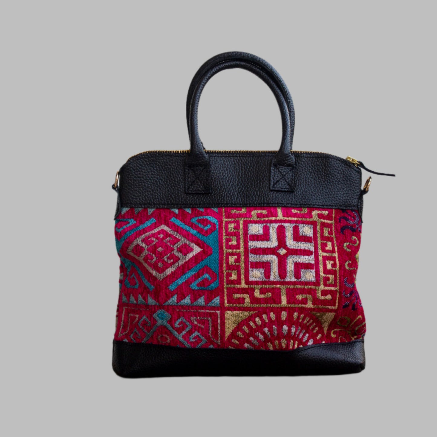 Weekend Kilim Genuine Leather Bag is Handcrafted in Old Cairo, Egypt, This bag is one of a kind  masterpiece, made from vintage fabrics and genuine leather to embody the essence of sustainable luxury.a gift to the world of Ancient craftsmanship meeting modern functionality. A statement of creativity, cultural awareness and limitless style.