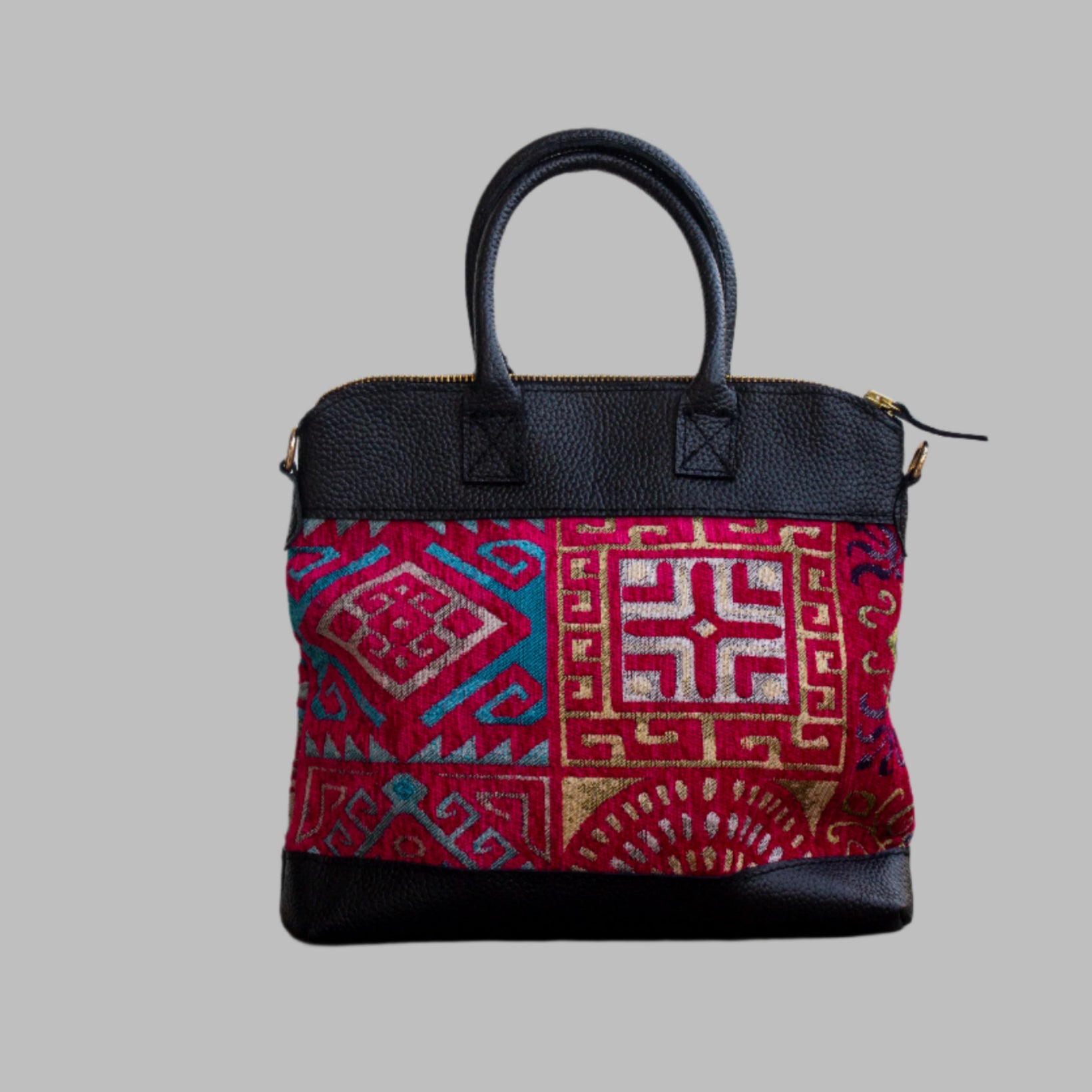 Weekend Kilim Genuine Leather Bag is Handcrafted in Old Cairo, Egypt, This bag is one of a kind  masterpiece, made from vintage fabrics and genuine leather to embody the essence of sustainable luxury.a gift to the world of Ancient craftsmanship meeting modern functionality. A statement of creativity, cultural awareness and limitless style.