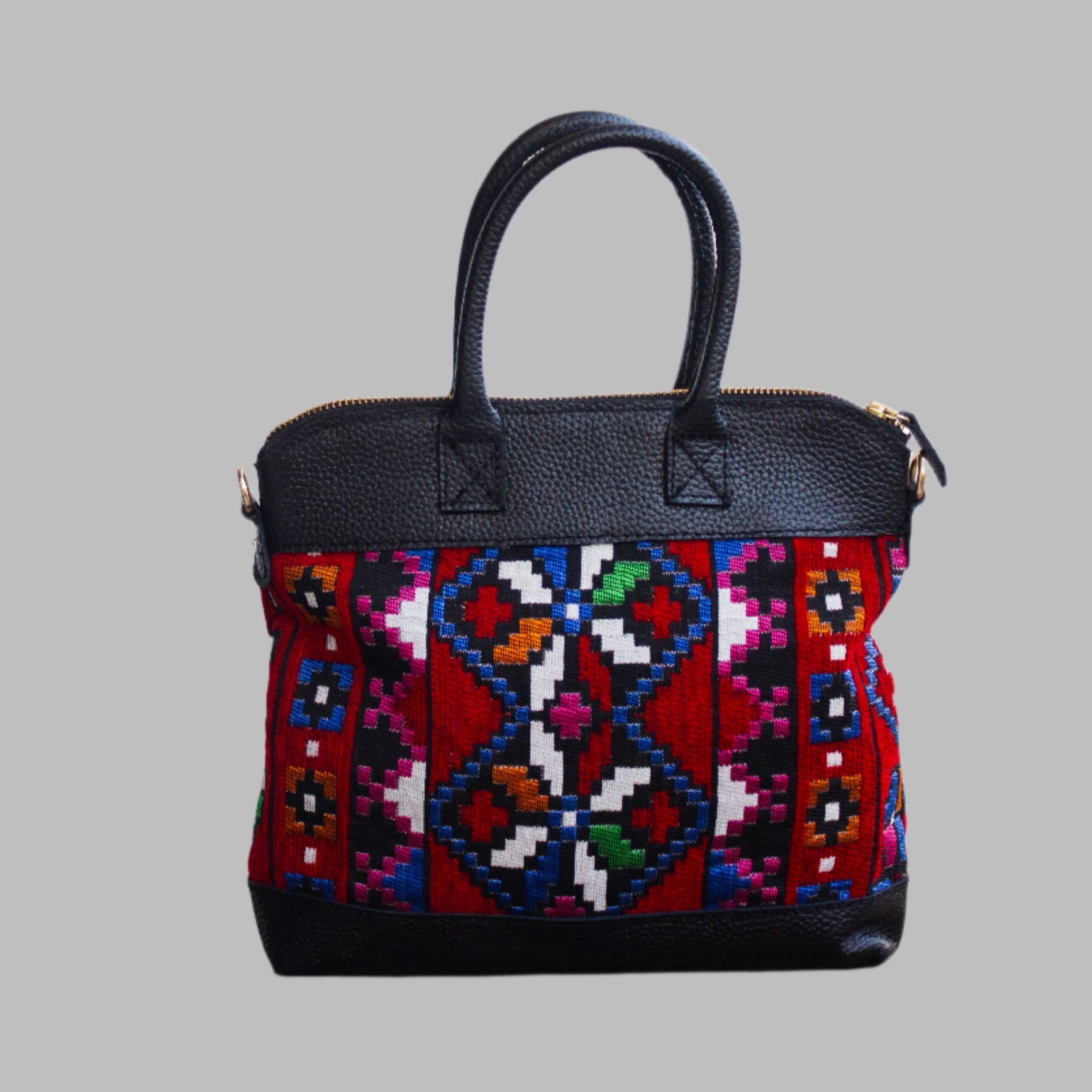 Weekend Kilim Genuine Leather Bag is Handcrafted in Old Cairo, Egypt, This bag is one of a kind  masterpiece, made from vintage fabrics and genuine leather to embody the essence of sustainable luxury.a gift to the world of Ancient craftsmanship meeting modern functionality. A statement of creativity, cultural awareness and limitless style.