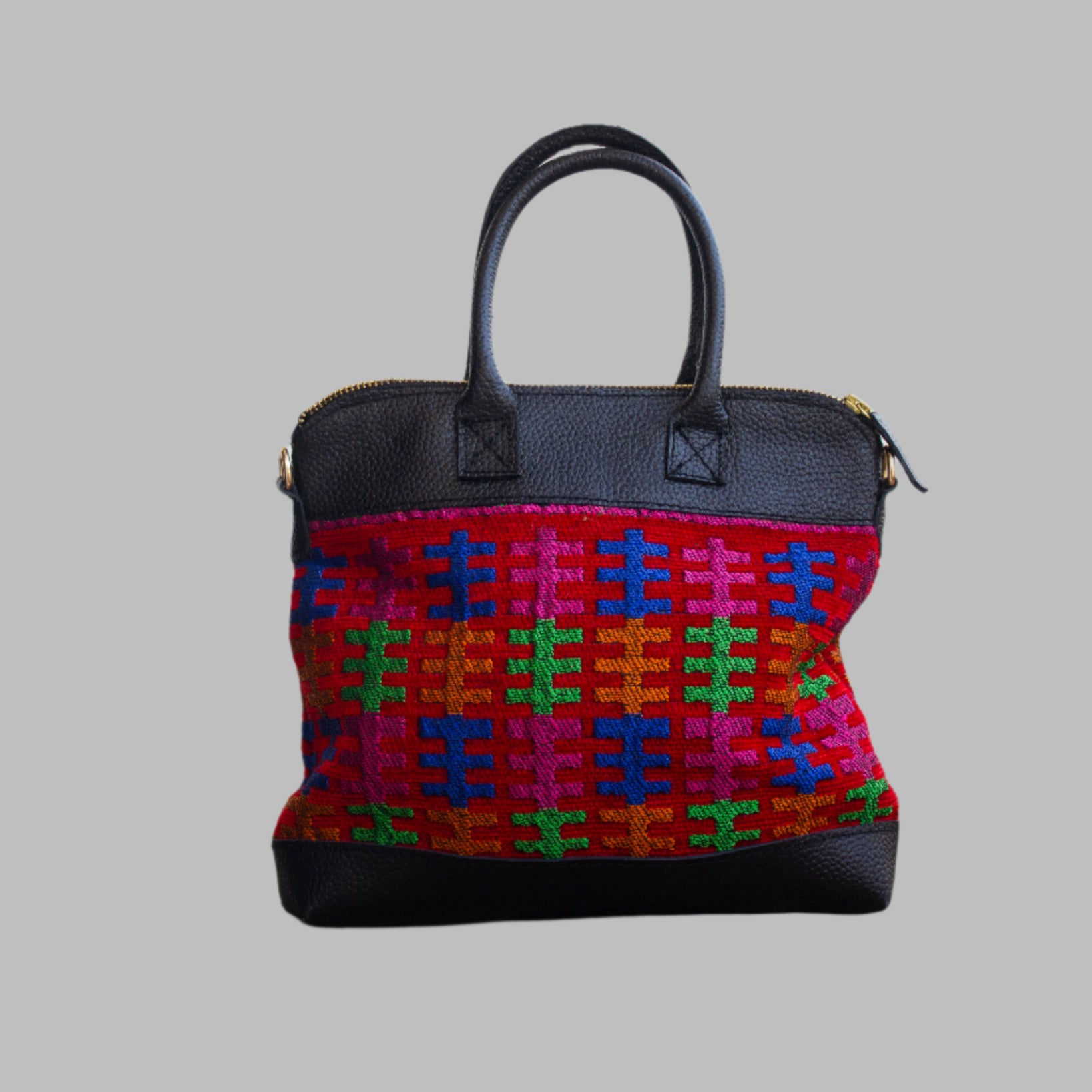 Weekend Kilim Genuine Leather Bag is Handcrafted in Old Cairo, Egypt, This bag is one of a kind  masterpiece, made from vintage fabrics and genuine leather to embody the essence of sustainable luxury.a gift to the world of Ancient craftsmanship meeting modern functionality. A statement of creativity, cultural awareness and limitless style.