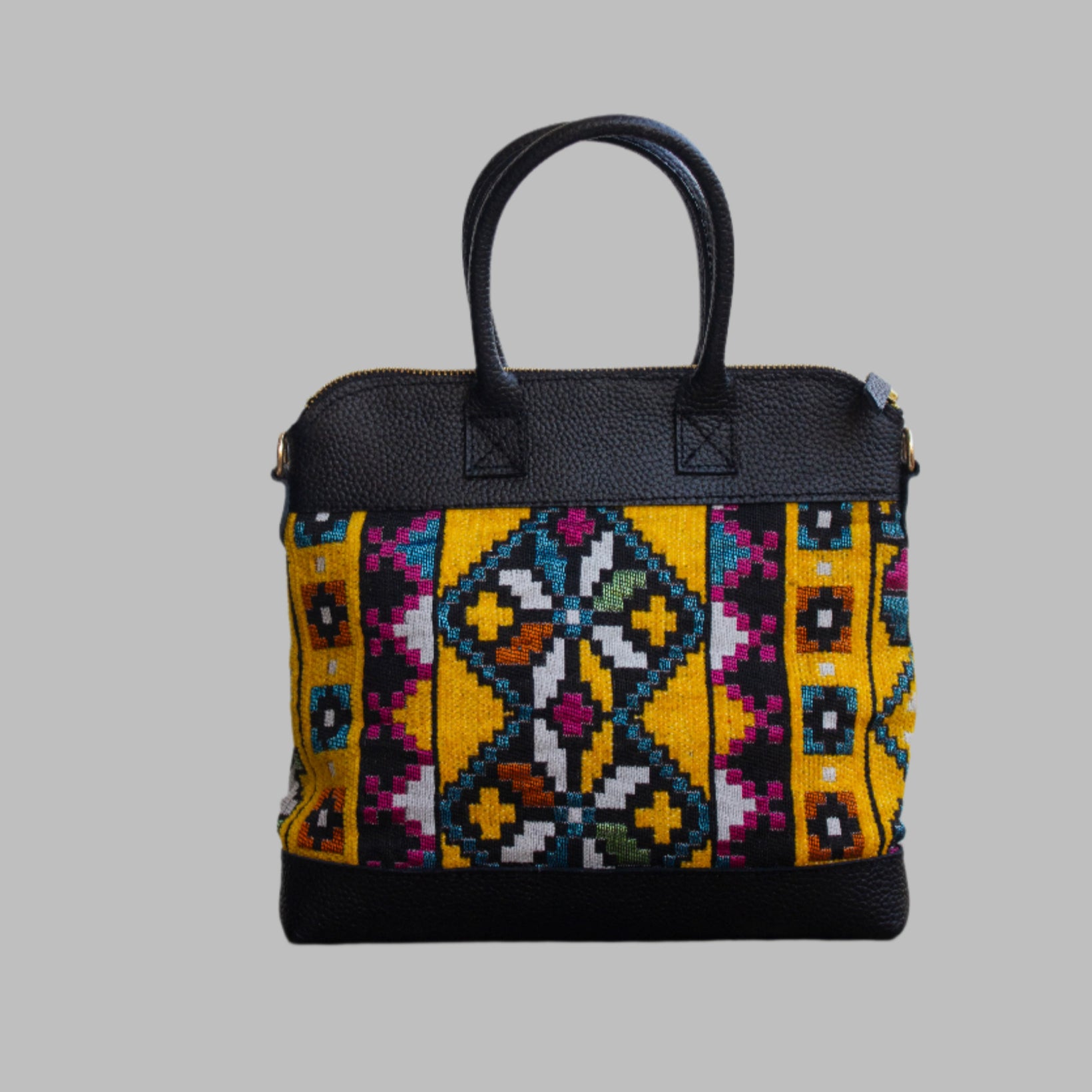 Weekend Kilim Genuine Leather Bag is Handcrafted in Old Cairo, Egypt, This bag is one of a kind  masterpiece, made from vintage fabrics and genuine leather to embody the essence of sustainable luxury.a gift to the world of Ancient craftsmanship meeting modern functionality. A statement of creativity, cultural awareness and limitless style.